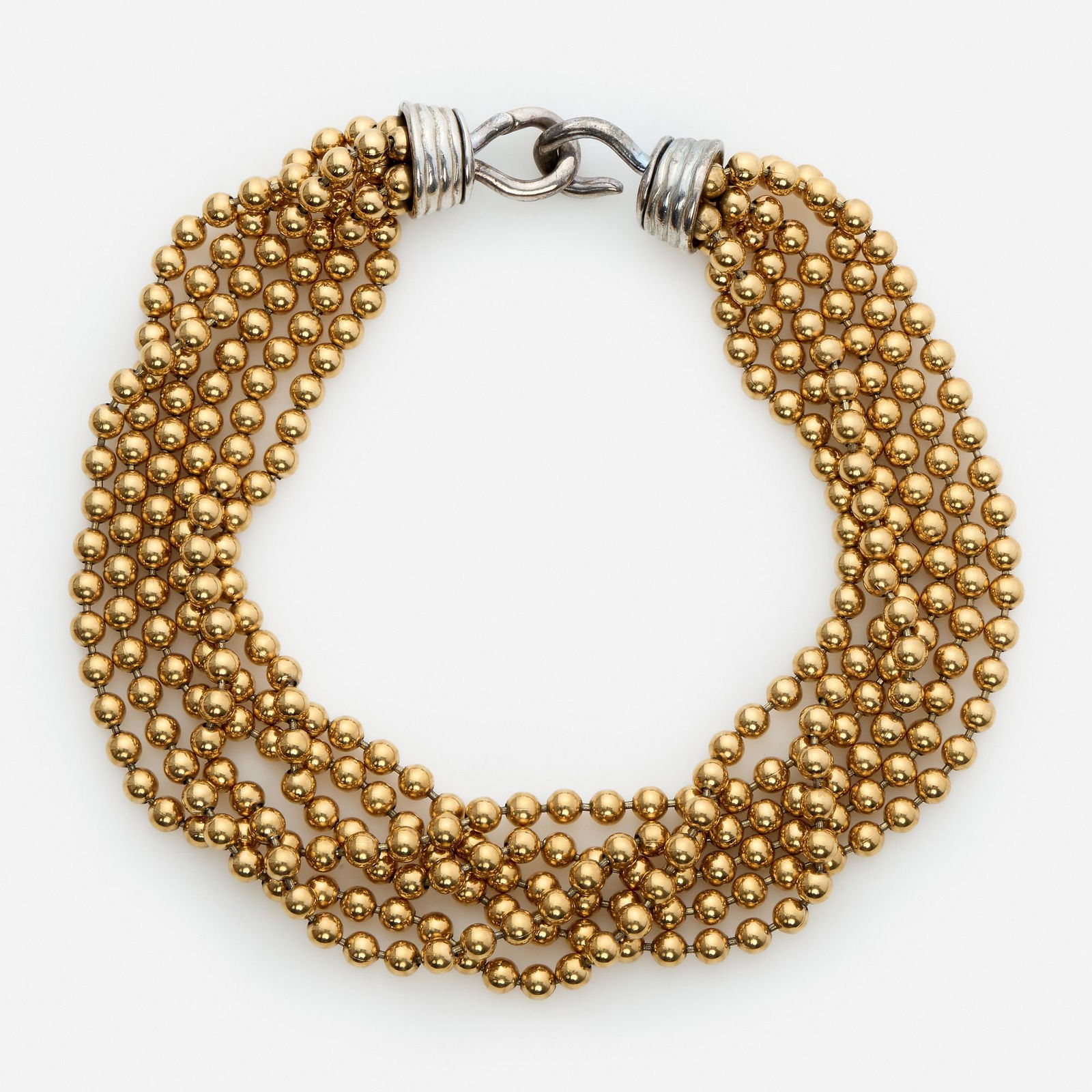 Givenchy Multi-Strand Gold Toned Ball Necklace: A six strand Givenchy necklace featuring metal gold tone balls linked together finishing in a large silver toned hook and eye clasp. Clasp Type: Hook and eye clasp Weight: 200.8 grams. Measurements: T
