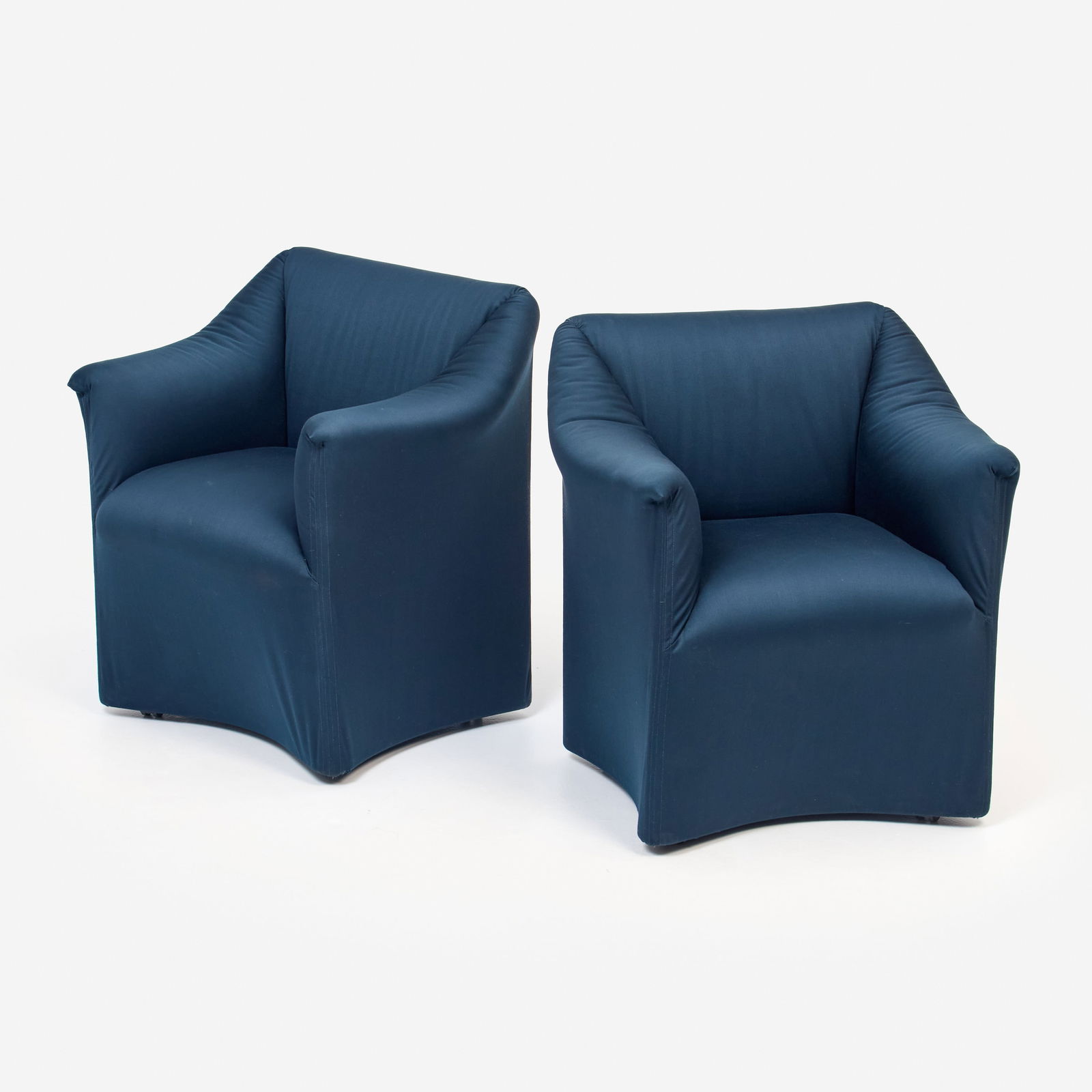 Mario Bellini for Cassina Pair of 684 Chairs: Mario Bellini Pair of 684 armchairs, Cassina Designed 1973 Upholstery, tubular steel and elastic webbing (structure), casters 33" x 31" x 27" Marked to the underside.