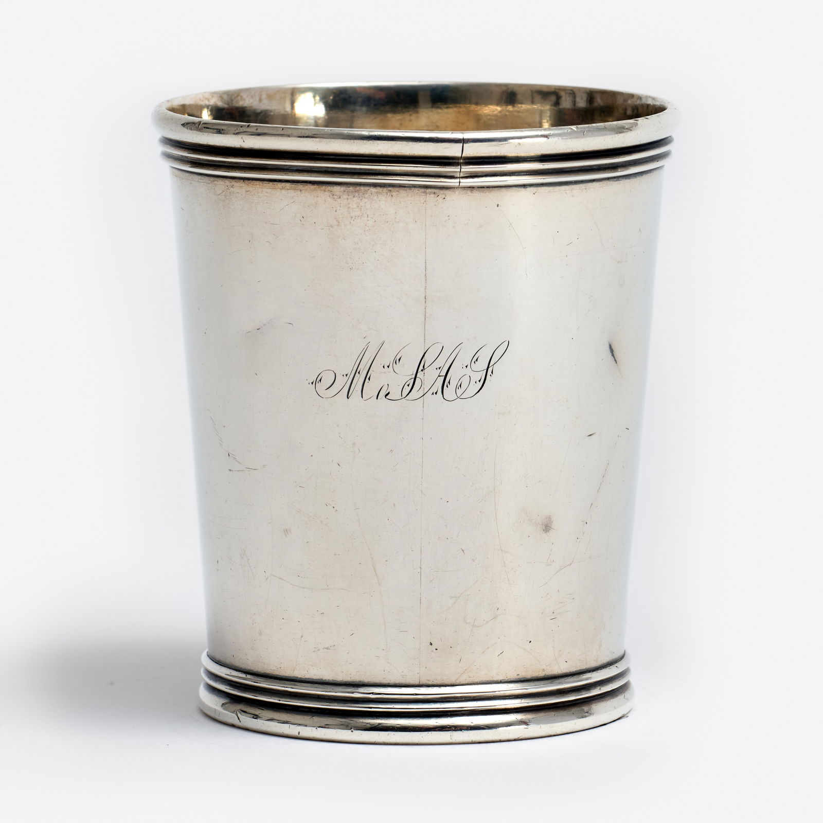 Missouri Silver Julep Cup, George Cook & Robert Simpson (1855, Boonville): An American coin silver mint julep cup, created by silversmiths George W. Cook [active 1843-1869] and Robert Simpson of Boonville, Missouri. Dated 1855 to the underside. Monogrammed "MoSAS," an award