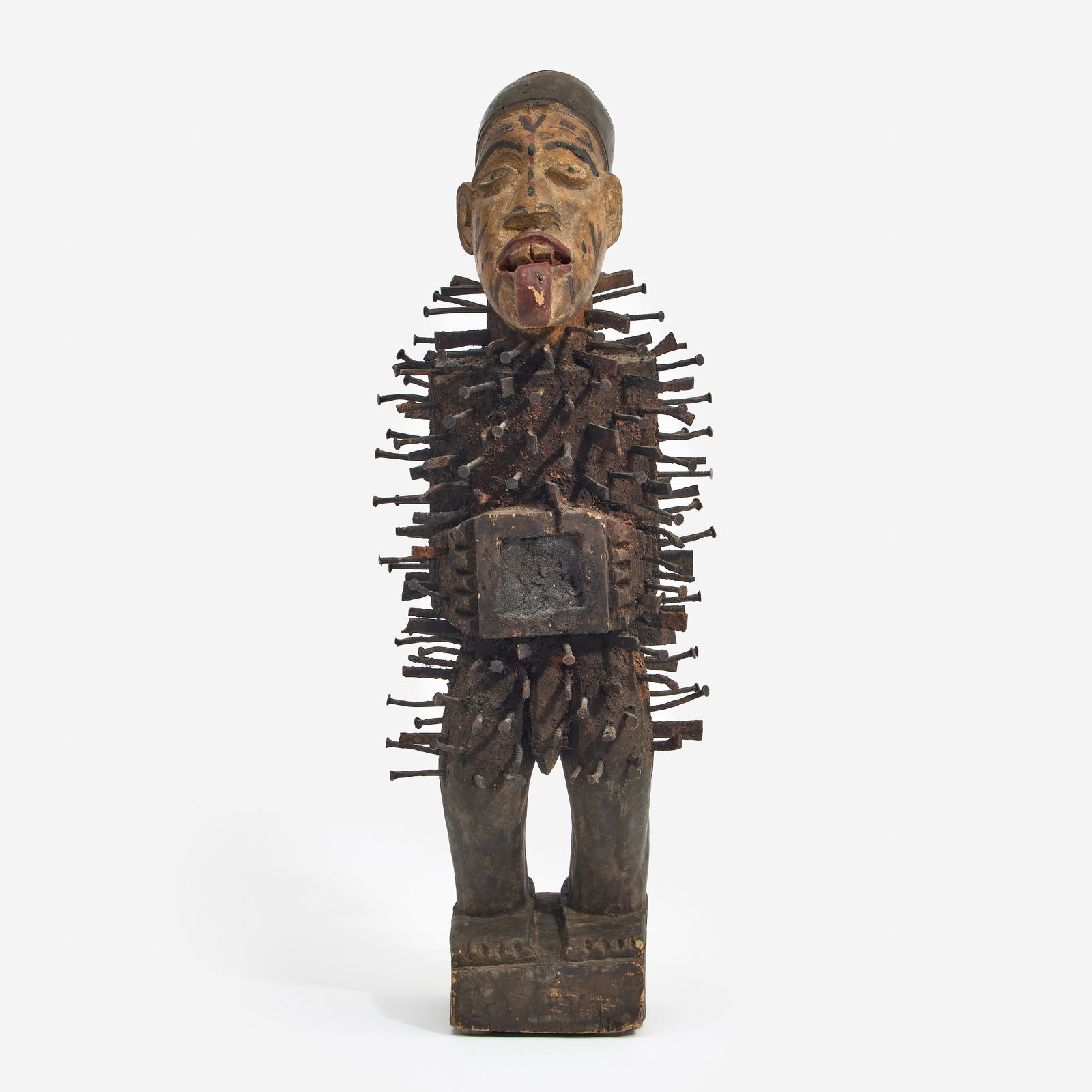Bakongo (Angola) Nkondi Nail Fetish: A Bakongo (Angola) nkisi nkondi nail fetish, having an elongated head with tongue extended out. Carved wood, hand-wrought nails, and polychrome paint. Measures 27" x 9" x 9".