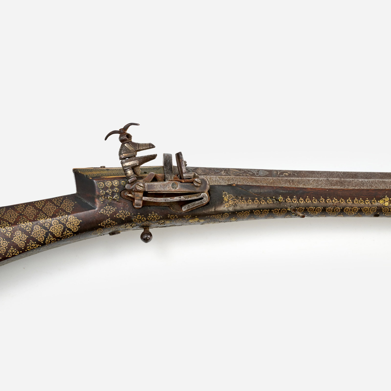 Ottoman Empire Miquelet Musket (ca. 18th c.): A shishane musket of the Ottoman Empire, circa 18th century. Gabrovo-style miquelet lock, extensive intricate inlay of brass rosettes and bone, 32" octagonal Damascus steel barrel.