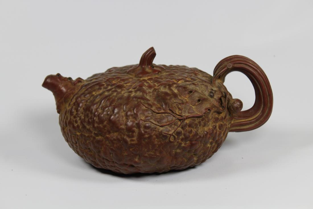 Chinese, Carved Clay Teapot: Chinese, Carved Clay Teapot. Marked on inside of lid. Width: 7.5 inches.