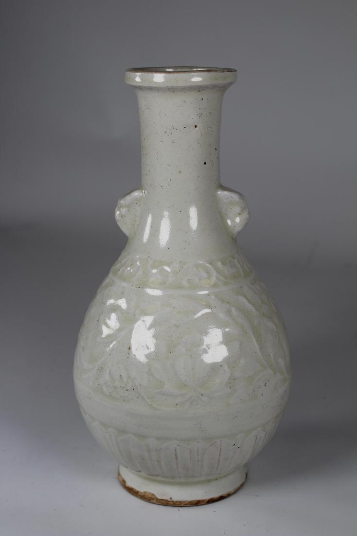 Chinese, Glazed Terracotta Floral Vase: Chinese, Glazed Terracotta Floral Vase. With uncontrolled glaze, floral sprays throughout central portion of vase. Height: 9.5 inches.