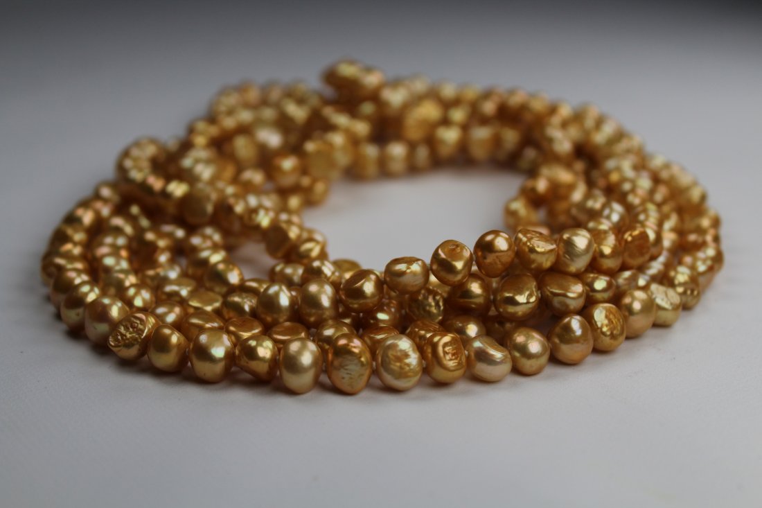 100 inch Strand of Gold Freshwater Pearl Necklace: Unusual 100 inch Strand of Gold Freshwater Pearl Necklace. The pearls on this necklace are approx. 9 mm in size.