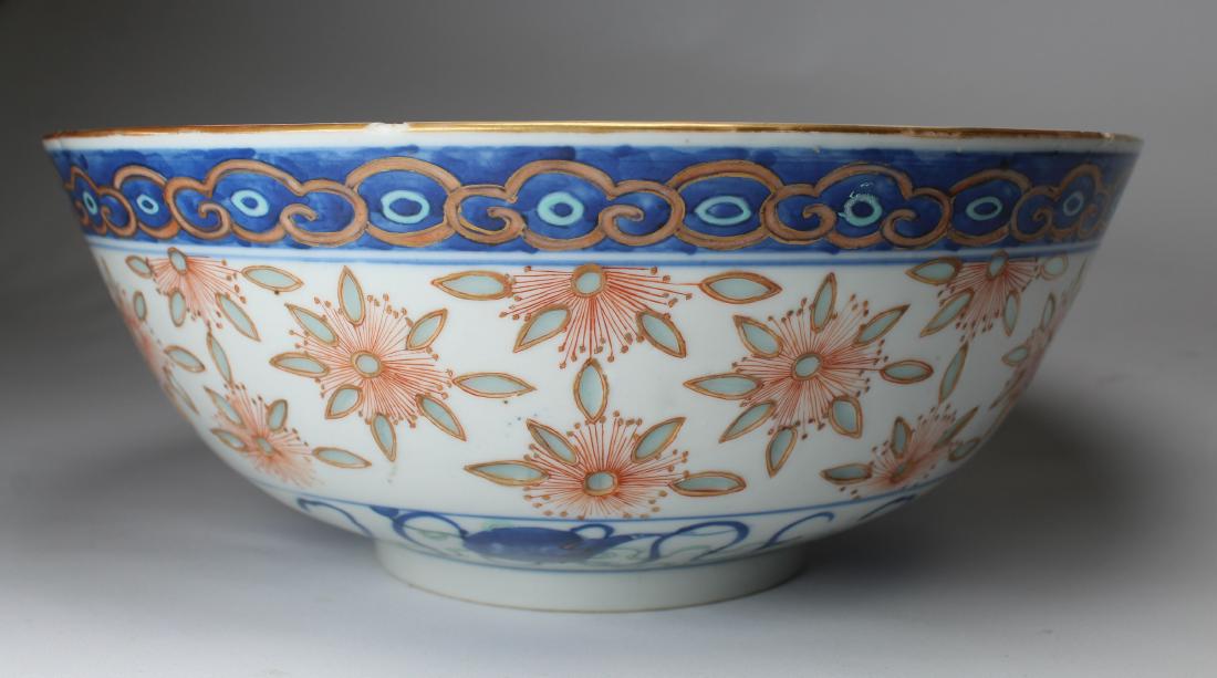 Chinese Hand Painted Porcelain Bowl, Signed: Chinese Hand Painted Porcelain Bowl, Signed with four character mark on bottom. With floral motif painted near rim of the interior of the bowl. Diameter: 10 inches.