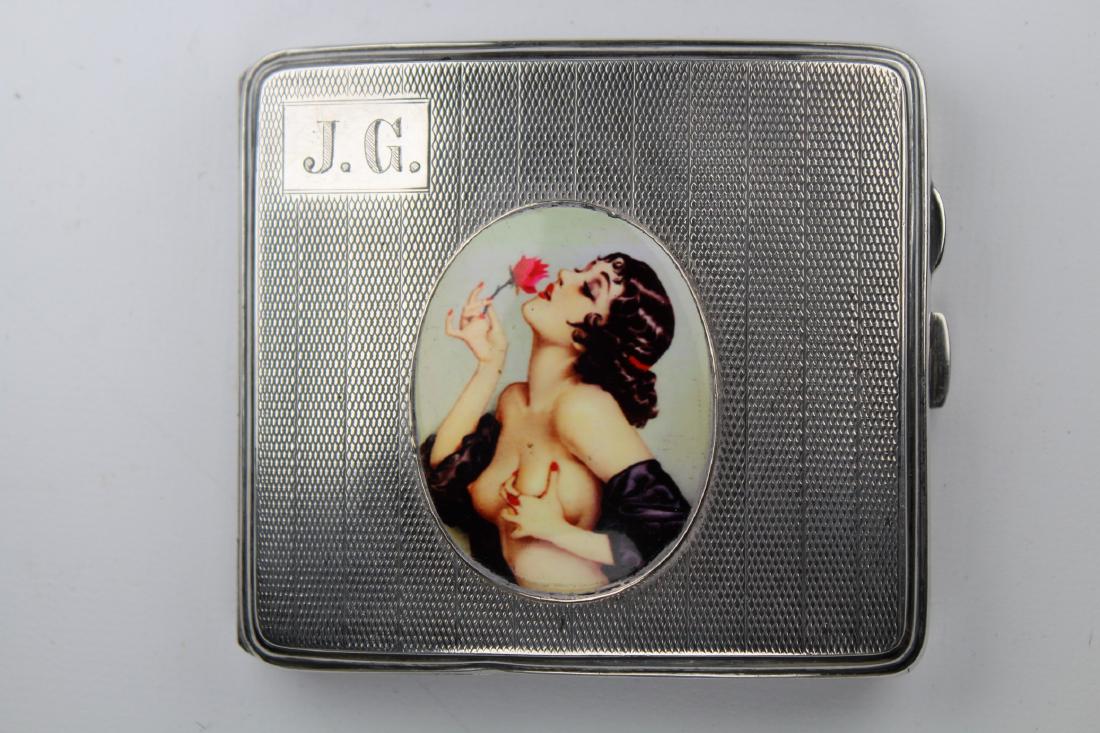 20th C. 'Nude Woman' Silver Cigarette Case: 20th C. 'Nude Woman' Silver Cigarette Case with woman holding rose on front of case. Monogrammed 'J.G'.' in upper left corner. Stamped inside case. Size: 3.25 x 3.75 in.