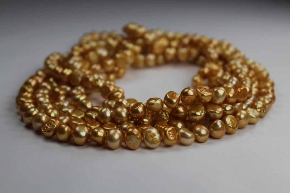 100 inch Strand of Gold Freshwater Pearl Necklace: Unusual 100 inch Strand of Gold Freshwater Pearl Necklace. The pearls on this necklace are approx. 9 mm in size.