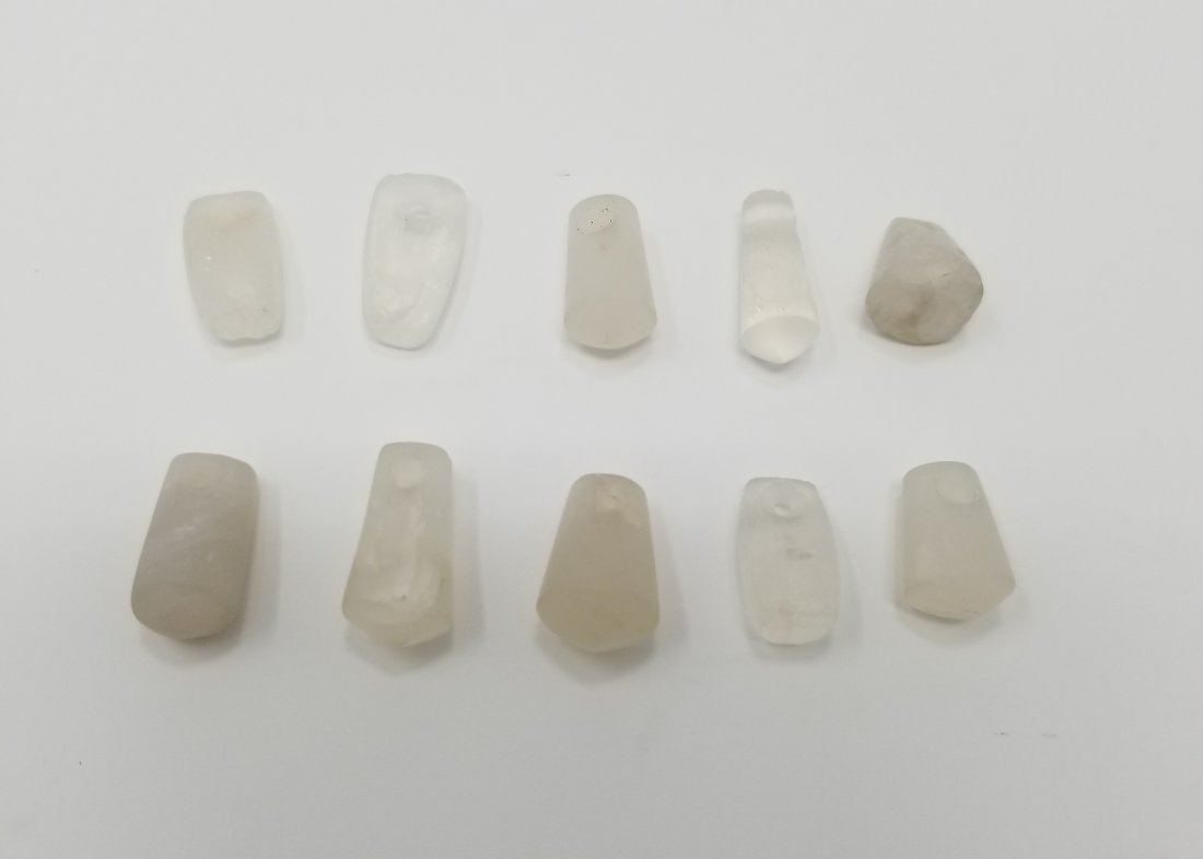 (10) Tairona Crystal Pendants, ca. 1000 - 1500 AD: A choice group of 10 Tairona crystal pendants from Colombia, ca. 1000 - 1500 AD. They are 1/2" to 3/4" long and are made from translucent, polished crystal, perforated for suspension.