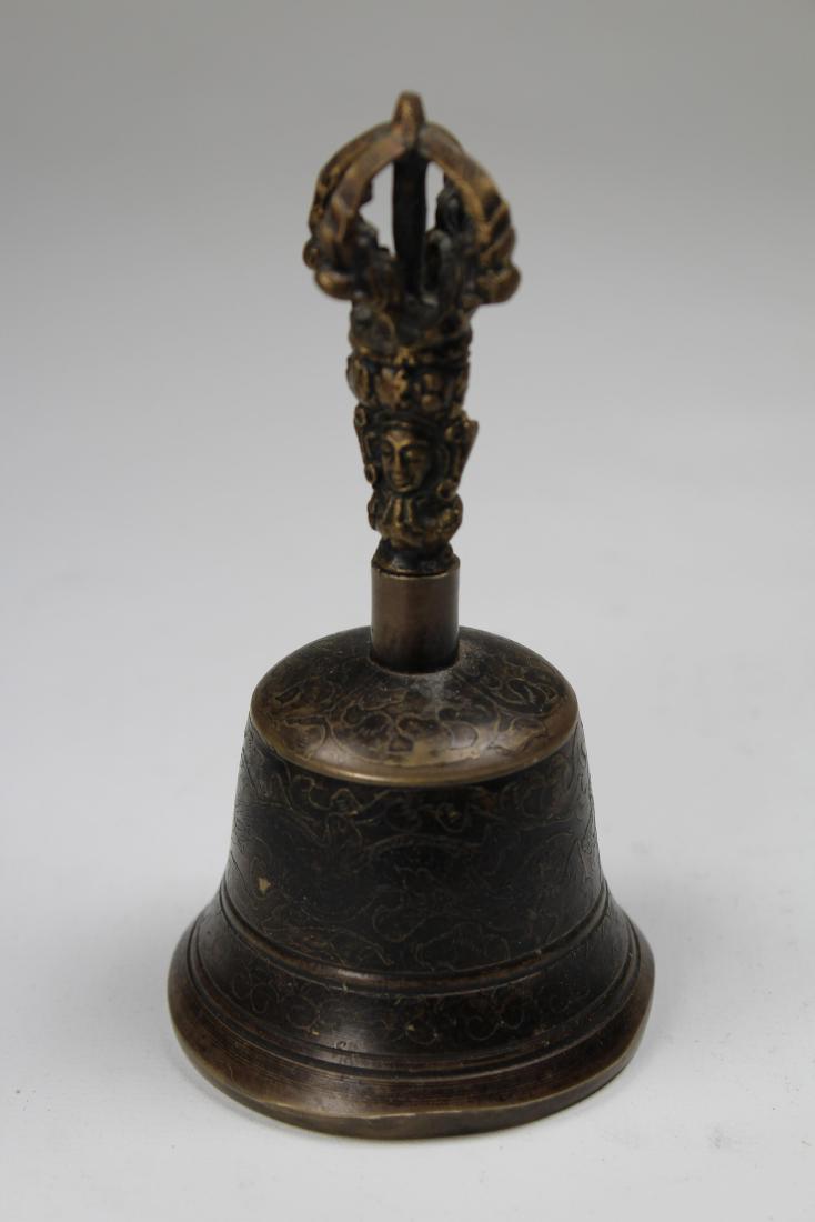 Early Antique Tibetan Ritual Bell: Early Antique Tibetan Ritual Bell with floral motif incised throughout exterior. Height: 5 inches.