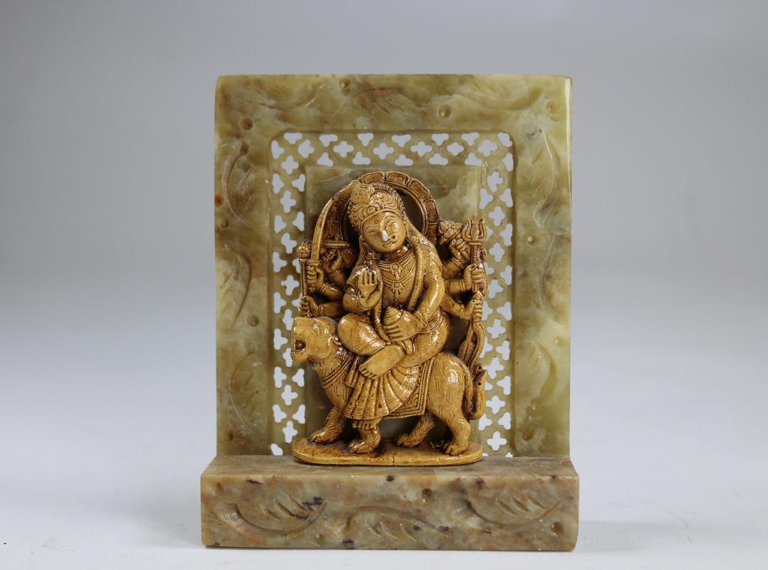 Krishna Figurine on Carved Soapstone Base: Krishna Figurine on Carved Soapstone Reticulated Base. Height: 4 in.