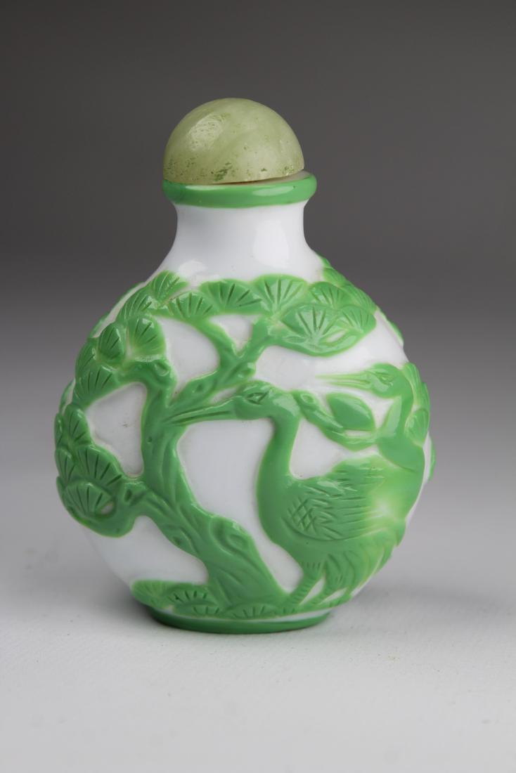 Chinese Snuff Bottle W/ Jade Stopper: Chinese Snuff Bottle W/ Jade Stopper. Height: 3 inches.