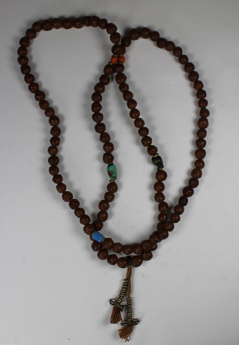 Tibetan Buddhist Mala Prayer Beads: Tibetan Buddhist Mala Prayer Beads with Coral and Turquoise beads, silver bell and dorjie counters.