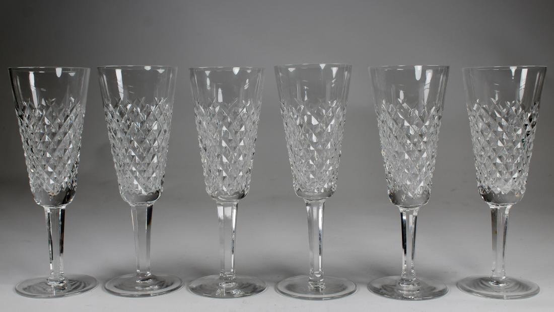 (6) Signed Waterford Champagne Flutes: (6) Signed Waterford Champagne Flutes. Signed on base. Height: 7.25 in.