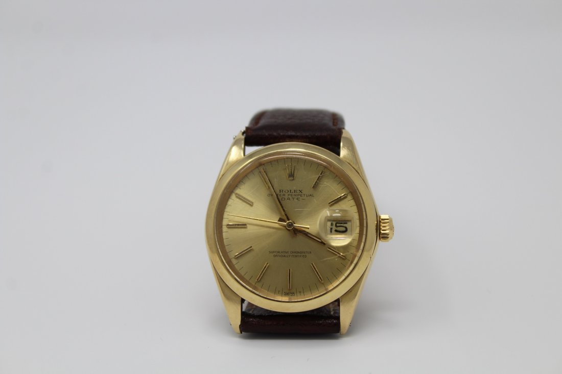 Vintage Rolex Oyster Perpetual 14K Gold Men's Watch: Vintage Rolex Oyster Perpetual 14K Gold Smooth Bezel Men's Watch with Leather Band. Stamped 14K on edge of case. Case Diameter: 34 mm