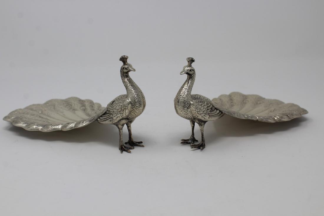 Pair of Gorham Sterling Silver Peacock Dishes: Pair of Gorham Sterling Silver Peacock Dishes, 20th C, bearing Durgin-Gorham mark, modeled as standing peacocks with long tails that form a small dish. Total Weight: 5.84 ozt Sizes: 3.25 x 6 in. - All