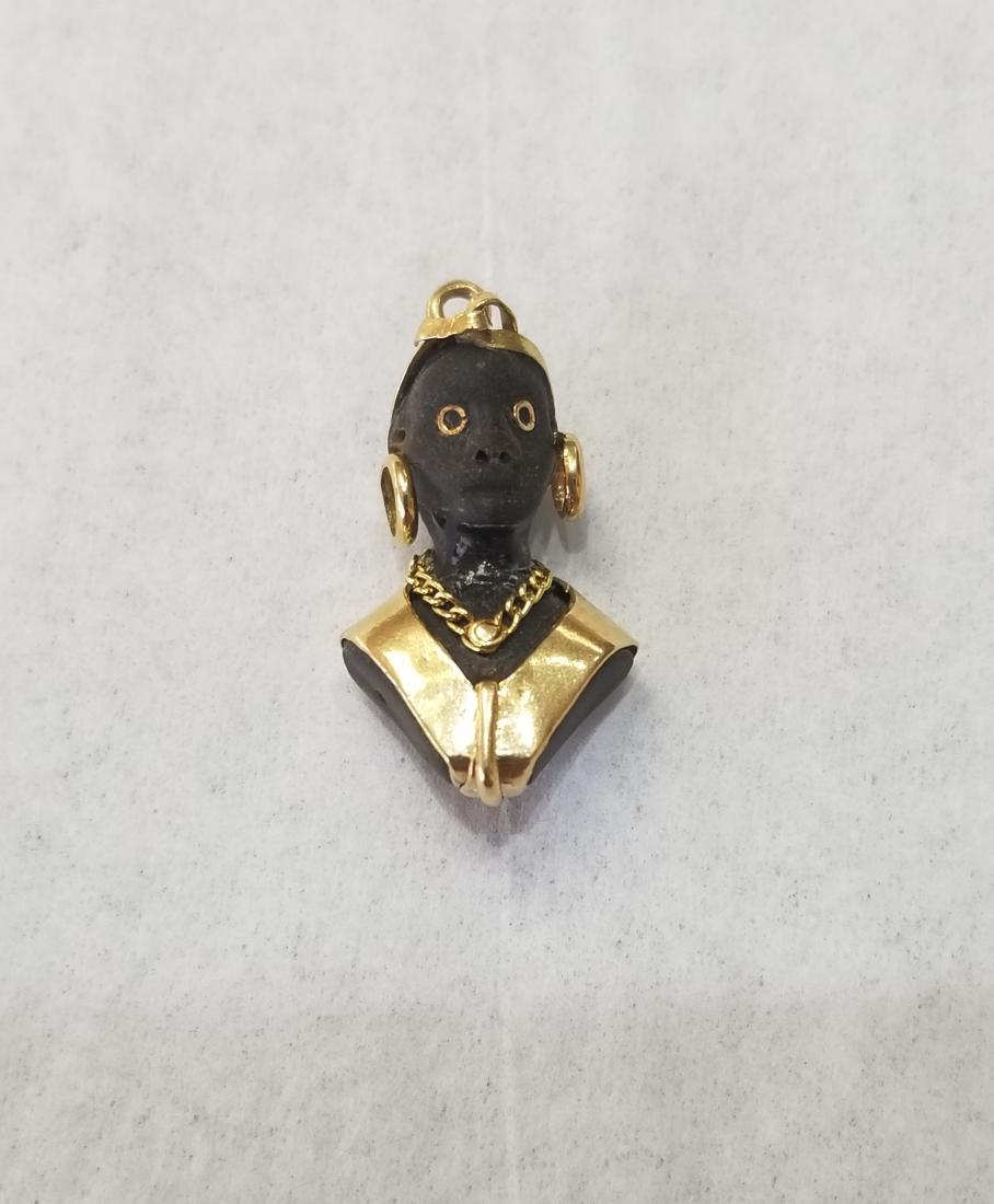 Carved Blackamoor & Gold Pendant: Carved Blackamoor & Gold Pendant. - All silver, gold and/or jewelry lots or invoices containing said lots MUST be paid for via WIRE TRANSFER or CASHIER"S CHECK, no other forms of payment will be accep