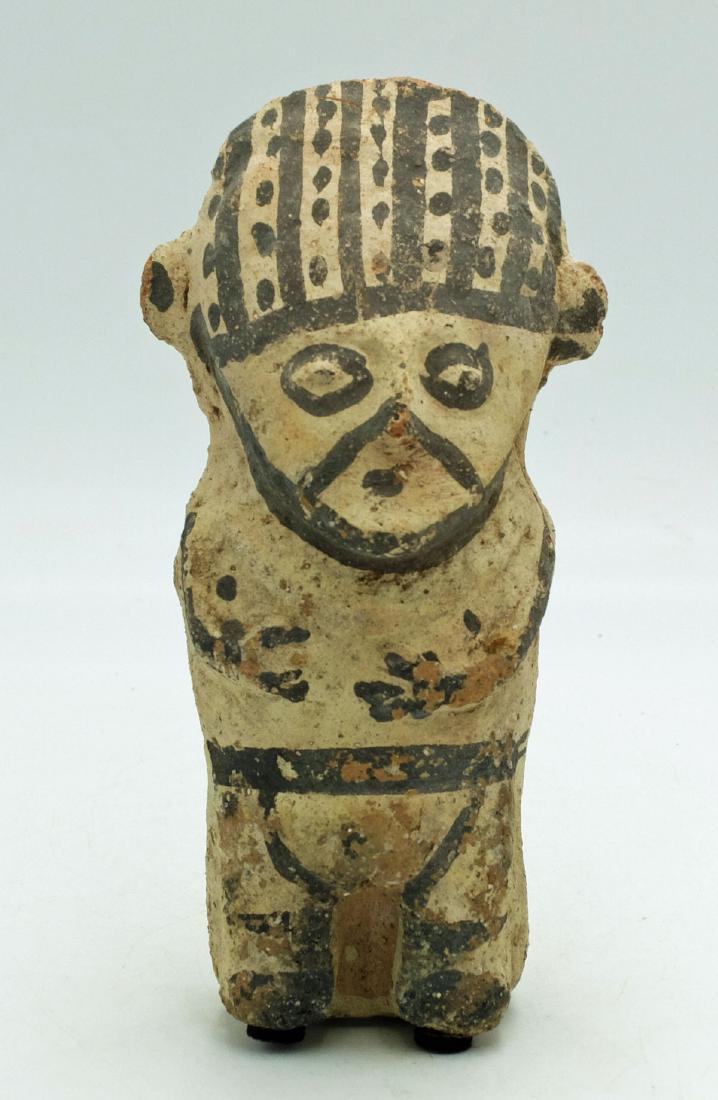 Chancay Figure - Peru, ca. 1100 - 1450 AD: A nice Chancay figure from Peru, ca. 1100 - 1450 AD. It is 6.25" high and depicts a standing female with hands held to the chest. She is wearing a fancy striped headdress and is adorned with a complex