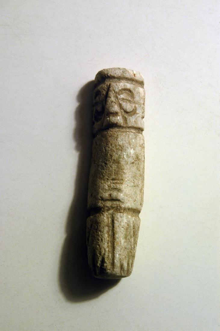 Mixtec Culture Penate - Oaxaca, Mexico: Mixtec Culture Penate (elongated form) - Oaxaca, Mexico, ca. 900-1400 CE. Found at Mitla ruinas, 1894. Length: 2 9/16 in. White and green polished hard stone; numerous deposits overall. Provenance: pr