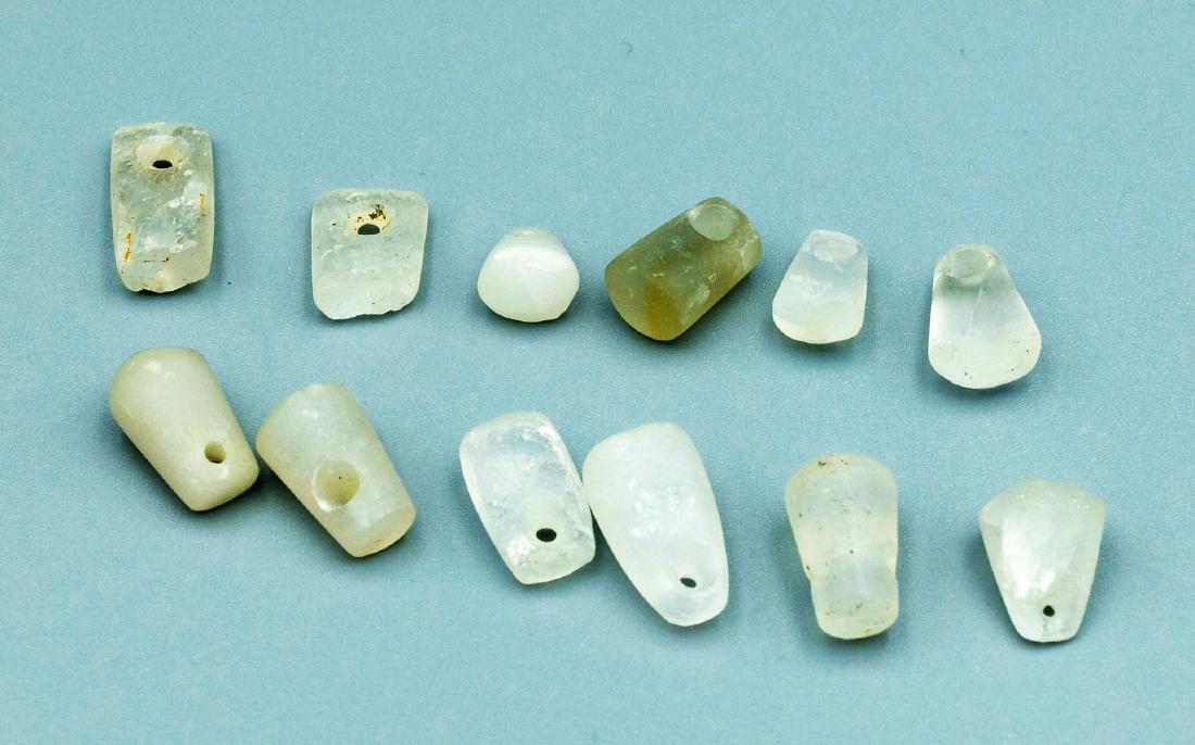 (12) Tairona Crystal Pendants - Colombia: A choice group of 12 Tairona crystal pendants from Colombia, ca. 1000 - 1500 AD. They are 1/2" to 7/8" long and are made from translucent, polished quartz crystal. SB222JM