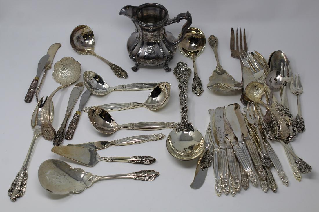 Lot of 44 Assorted Pieces of Silver Plate: Lot of 44 Assorted Pieces of Silver Plate articles.