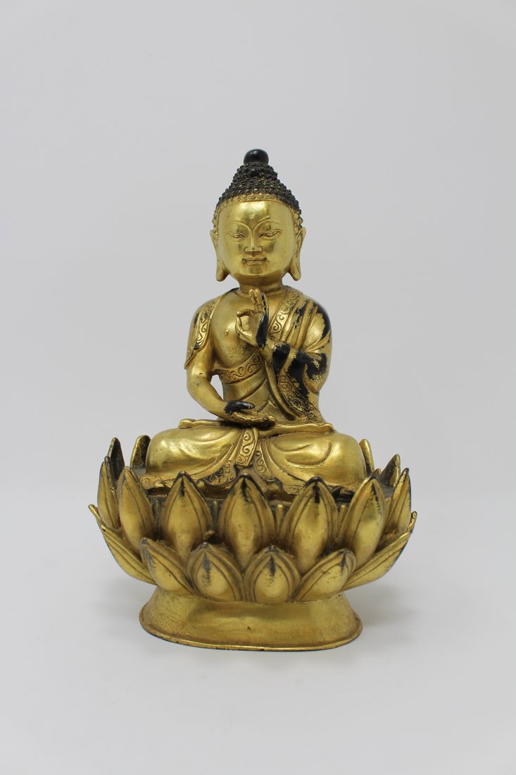 Gilt Bronze Seated Bhaishajyaguru Figure: Gilt Bronze Seated Bhaishajyaguru (Medicine Buddha) Figure on Double lotus form base. Height: 7.75 inches.