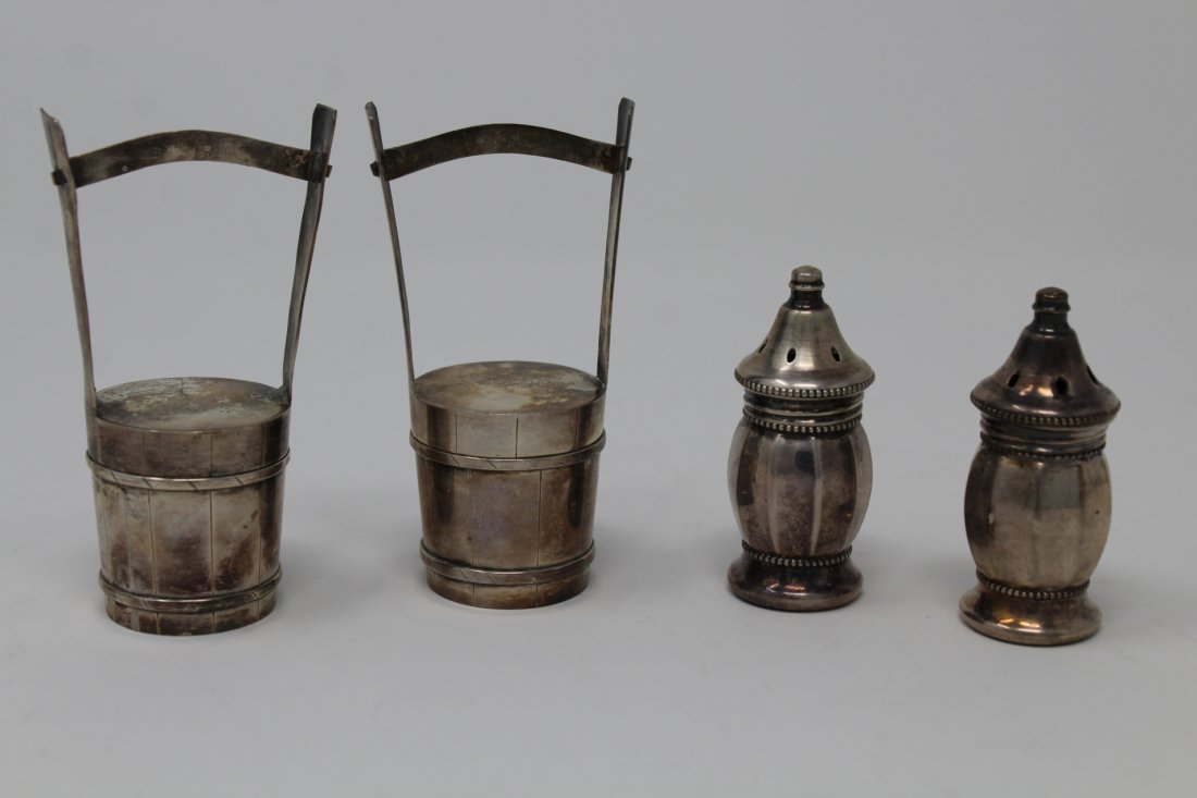 (2) Pairs of Sterling Salt & Pepper Shakers: (2) Pairs of Sterling Silver Salt & Pepper Shakers. One set in the shape of water buckets.Total Weight: 3.39 oztHeights: 3.25 / 2.25 in.