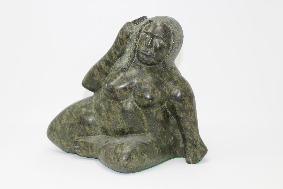 Inuit Carved Stone Nude Figure: Inuit Carved Stone Nude Figure. Signed on base. Size: 9.5 11 x 6.5 in. Approx. Weight: 16 lbs