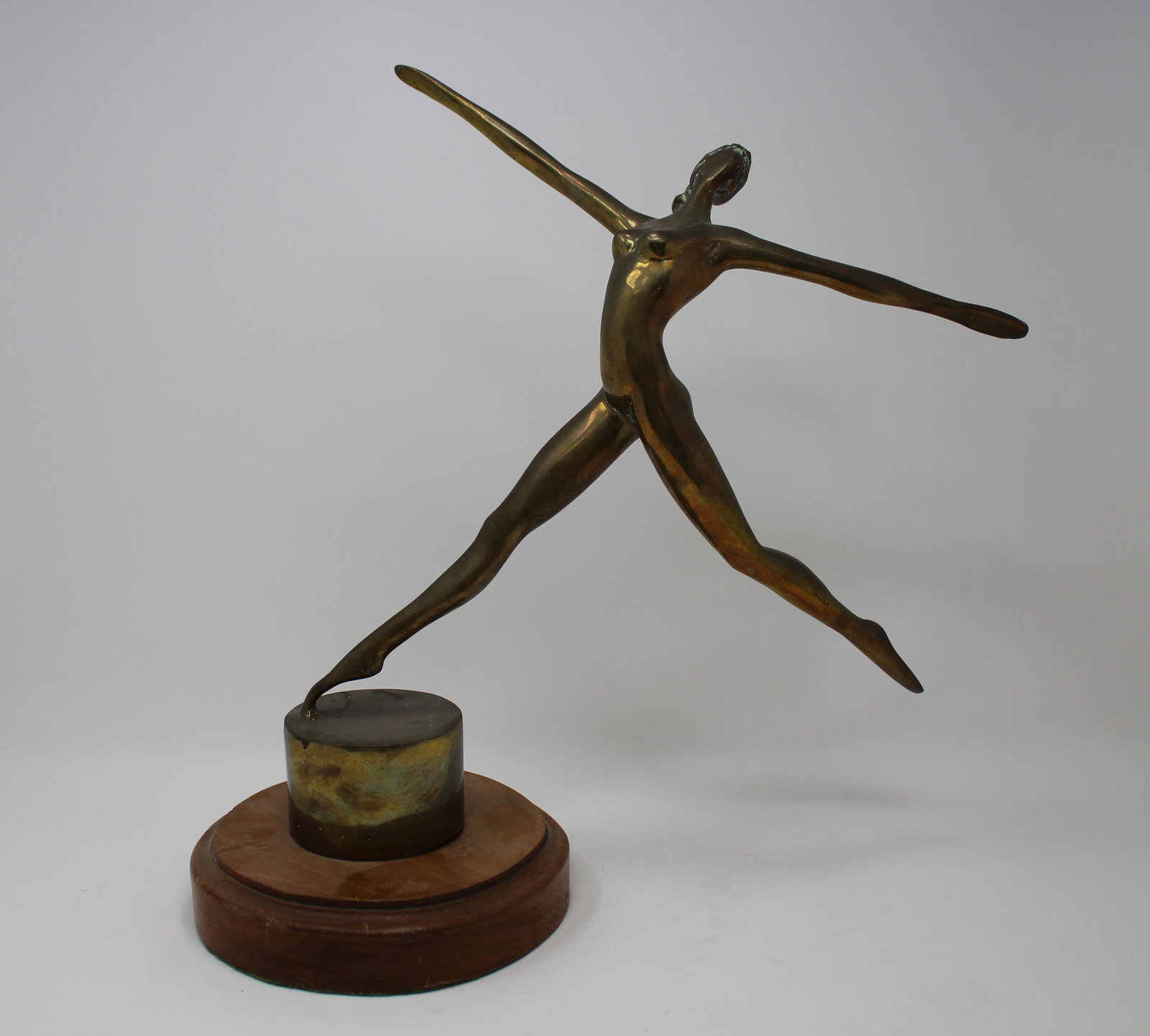 Mid Century Bronze Ballet Dancer on Wood Base: Mid Century Bronze Ballet Dancer on Wood Base. Appears to be unsigned. Height: 15 inches.