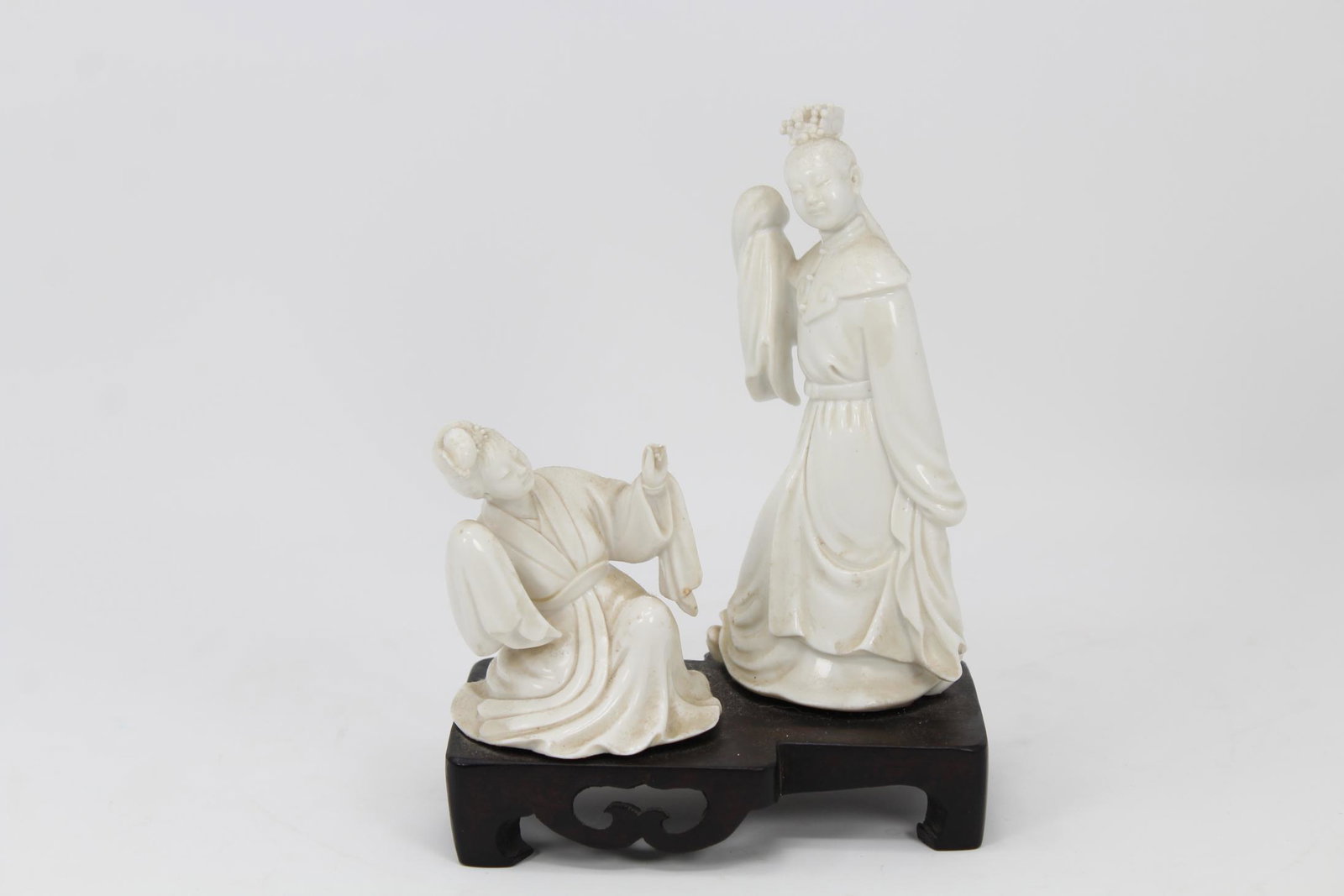 (2) Chinese Porcelain Figures on Stand: (2) Chinese Porcelain Figures on Hardwood Stand.