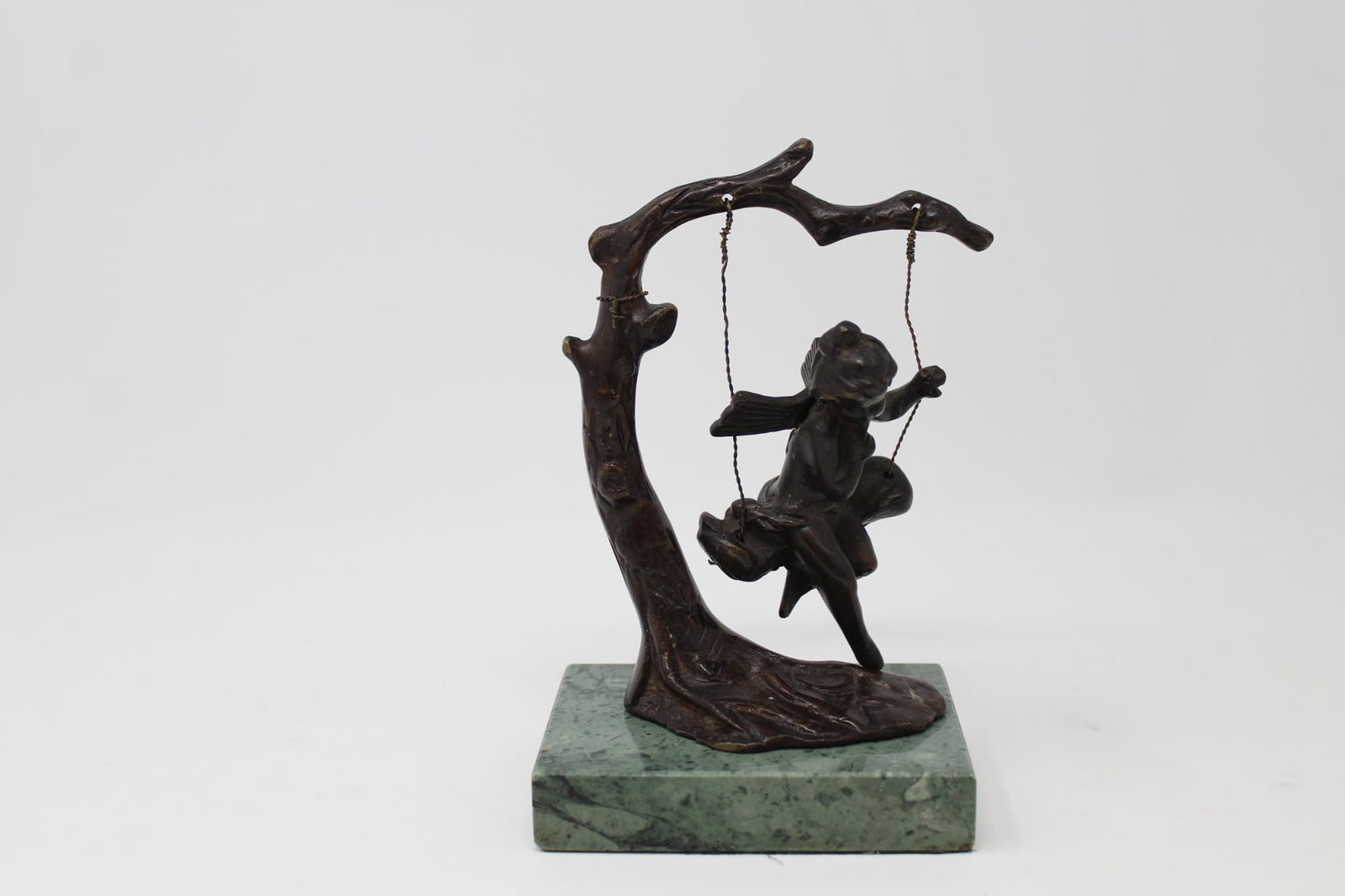 After Auguste Moreau (1834 - 1917): After Auguste Moreau (1834 - 1917) Bronze cherub on swing. Faintly inscribed near base. Total Height: 6.5 inches.