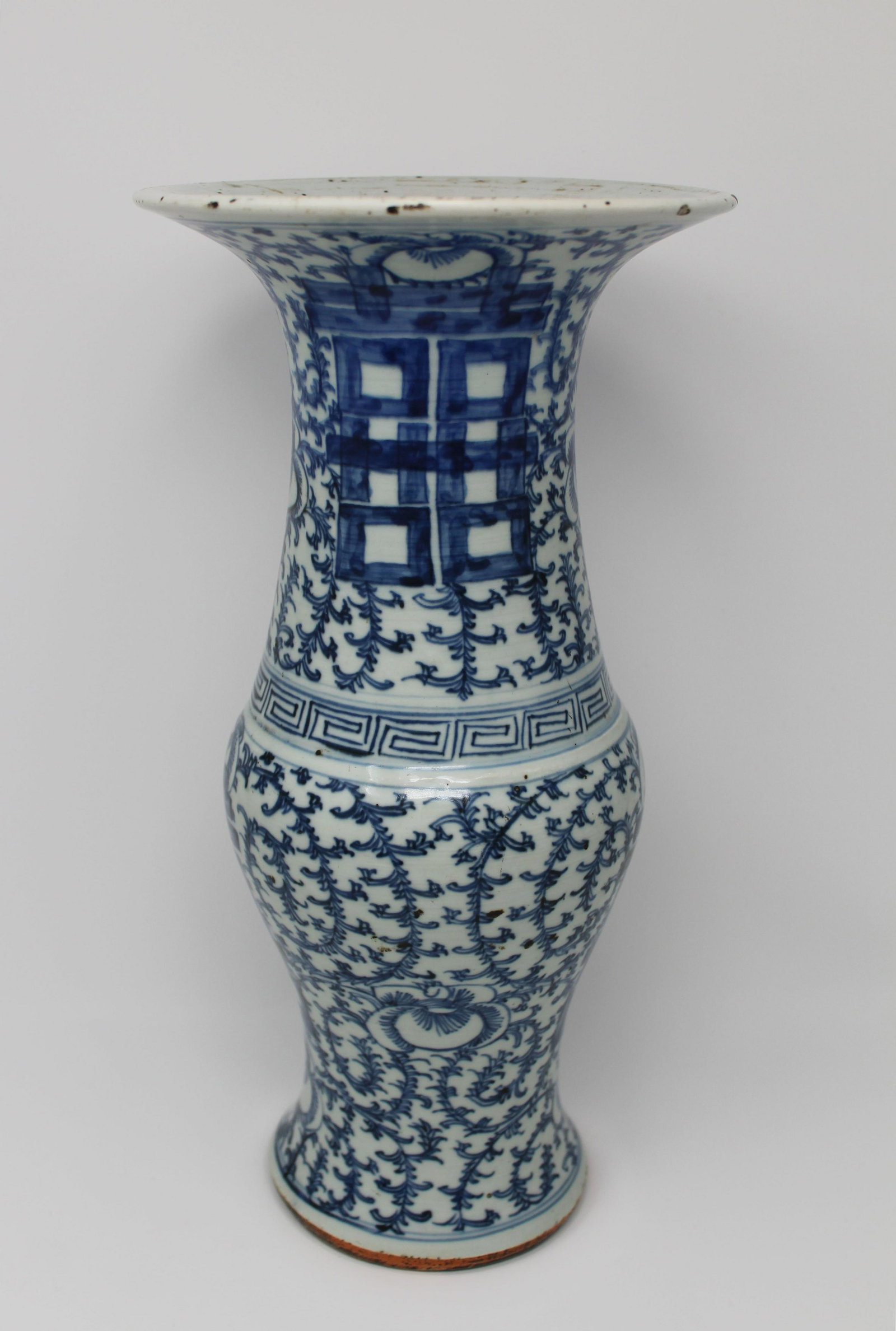 Early Antique Chinese Blue/White Porcelain Vase: Early Antique Chinese Blue/White Porcelain Baluster Vase. Depicting blue floral sprays throughout. Appears to be unmarked. Size: 15.25 x 7.5 in.