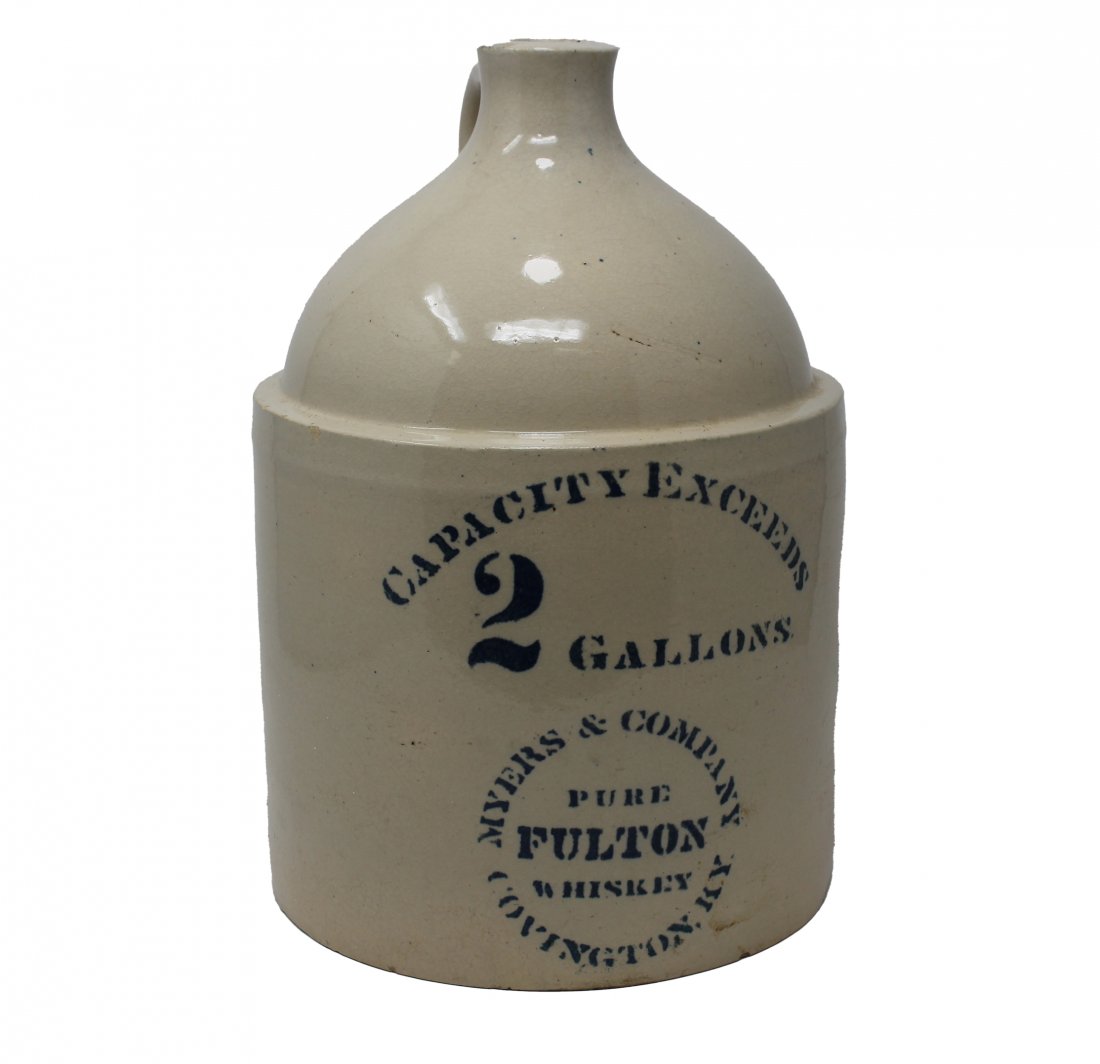 Myers & Company Pure Fulton Whiskey Covington Jug: 2-Gallon Myers & Company Pure Fulton Whiskey Covington Stoneware Jug. Dimensions: 13 x 9 in.