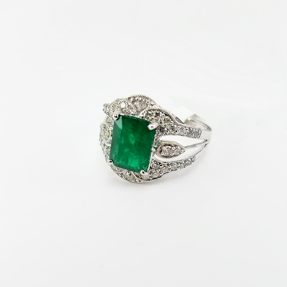 2ct Emerald & Diamond White Gold Ring: 2ct Emerald & Diamond White Gold Ring. Marked inside of band. Comes with GLA Certificate. Ring Size: 8 Total Colored Stone Weight: 2 ct Total Diamond Weight: 0.55 ctw Overall Weight: 3.9 g RN023781 - 