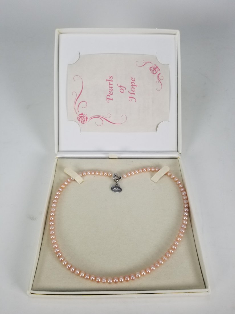 'Pearls Of Hope' Freshwater Pearl Necklace: Enjoy a treasured message of inspiration with this meaningful cultured freshwater pearl necklace. Necklace is finely handcrafted of pink cultured freshwater pearls and measures a full 18" long. A ster