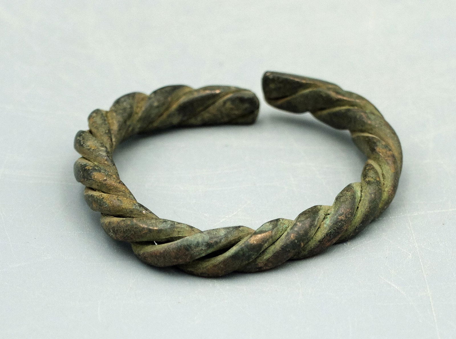Bronze Bracelet - Luristan, ca. 80 0 - 200 BC: A lovely bronze bracelet from Luristan, ca. 800 - 200 BC. This beautiful braided example is 2-1/4 inches wide and a lovely patina and strong mineral deposits. (LU383)