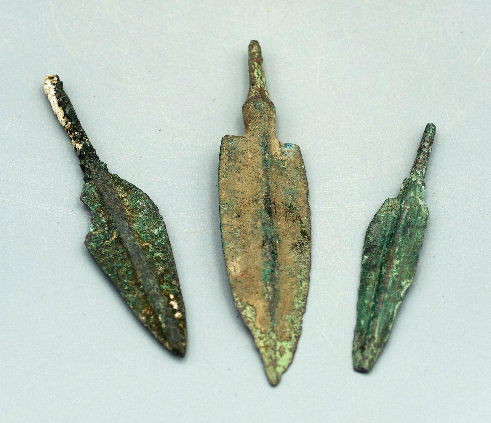 (3) Bronze Luristan Arrowheads, ca. 800 - 600 BC: A trio of large bronze Luristan arrowheads, ca. 800 - 600 BC. They range from 3-1/8 inches to 4-1/8 inches in length and all have a pronounce midrib. Nice set of different types, all with strong miner