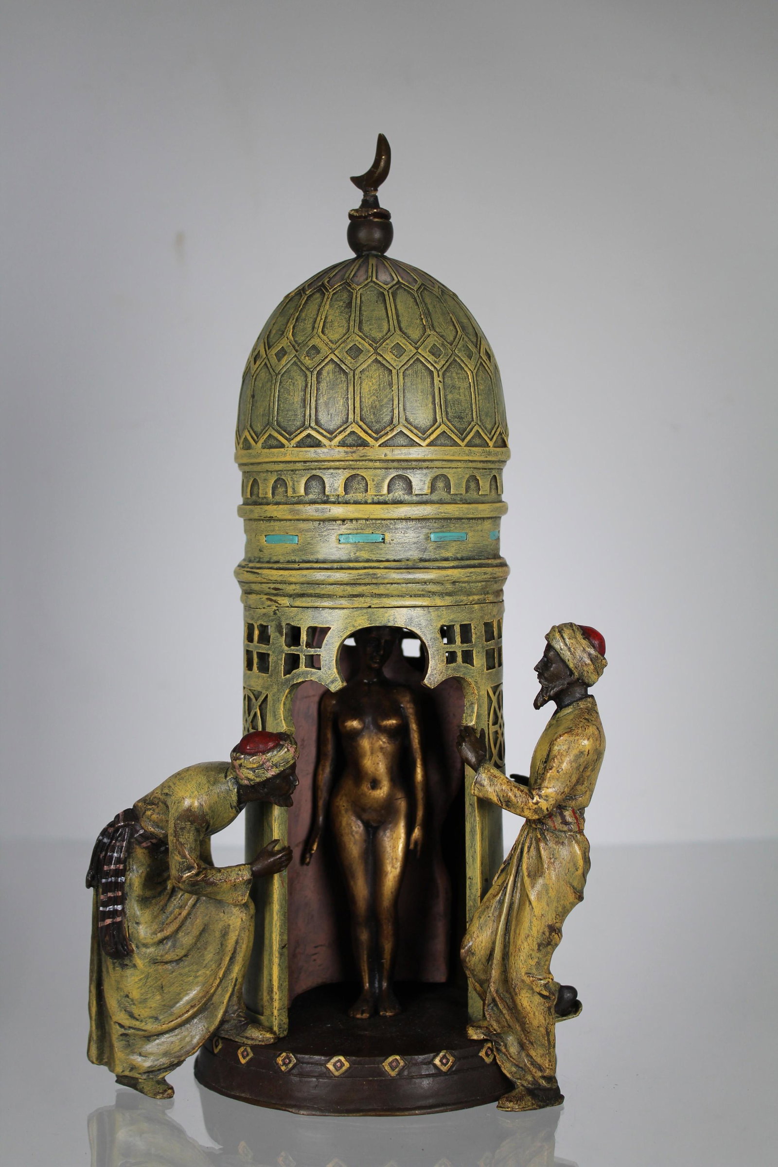 After Franz Bergman (1898 - 1963) Erotica: After Franz Bergman (Austria,1898 - 1963) Mechanical Erotic Bronze. Depicting two Arab men peering inside at a nude woman. Inscribed near base. Height: 12 in.