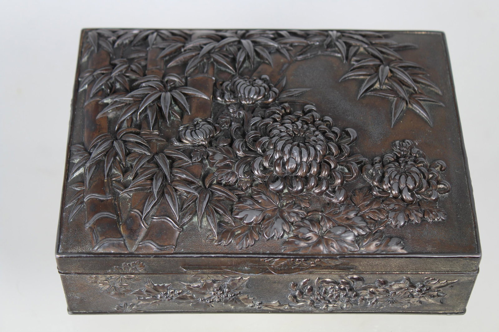 Antique Japanese Bronze Jewelry Box: Antique Bronze Japanese Jewelry Box. With floral motif throughout exterior of the box. Width: 7 in.