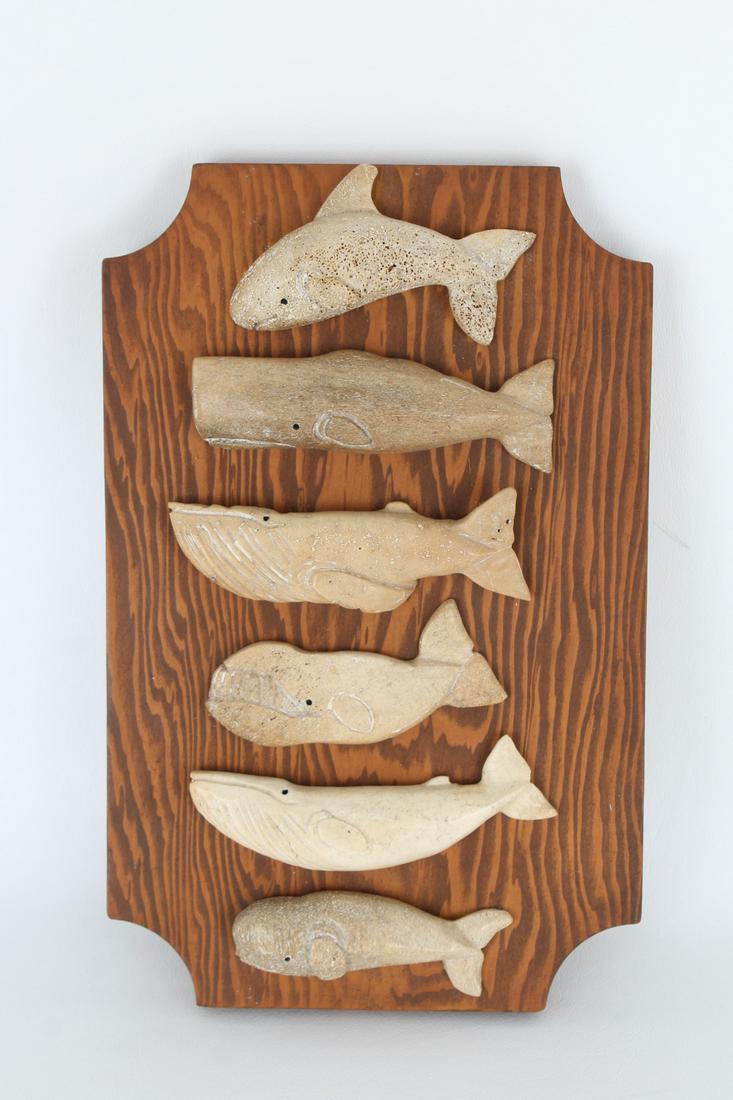 (6) Carved Stone Whale Figures: (6) Carved Stone Whale Figures mounted on board. Dimensions: 11 x 7.2 in.