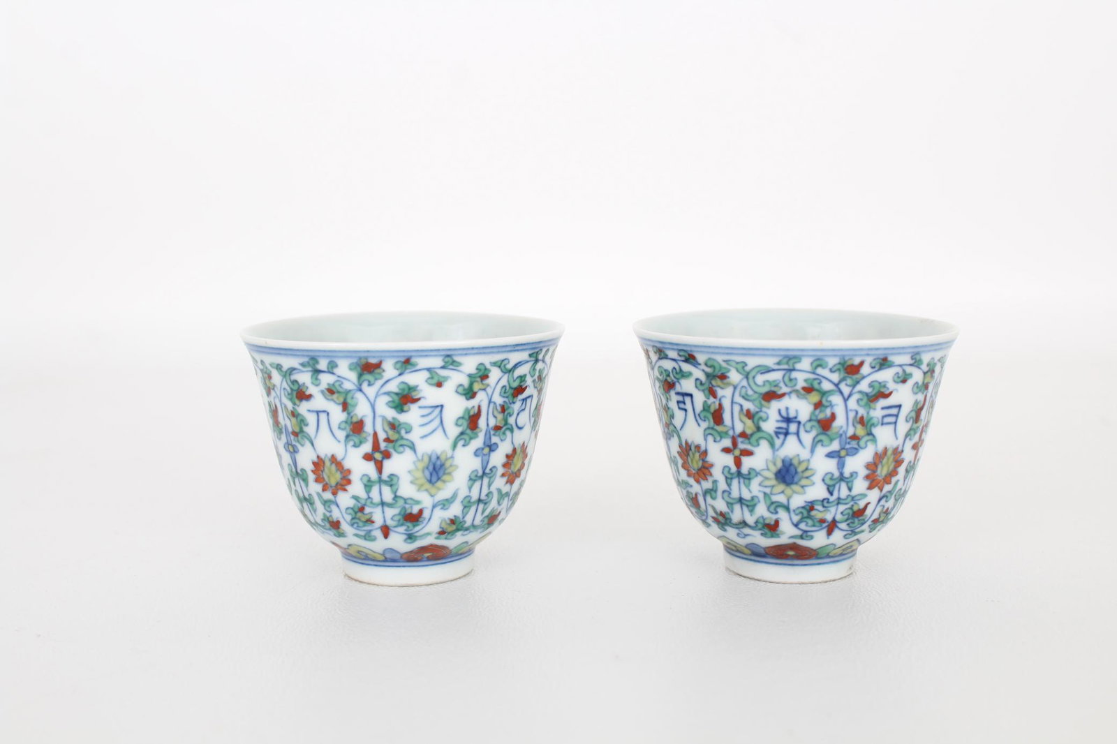 Rare Pair of Chinese Doucai'Sanskrit' Cups: Rare Pair of Chinese Doucai 'Sanskrit' Cups, Yongzheng mark Heights: 1 7/8 in.