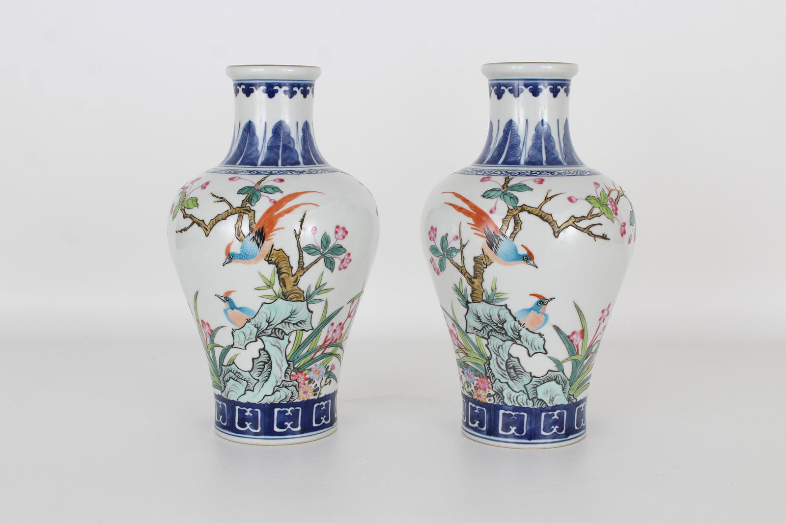 (2) Chinese Blue and White Porcelain Vases: (2) Chinese Blue and White Porcelain Vases. Each marked on bottom of each vase. Height: 9.5 in.