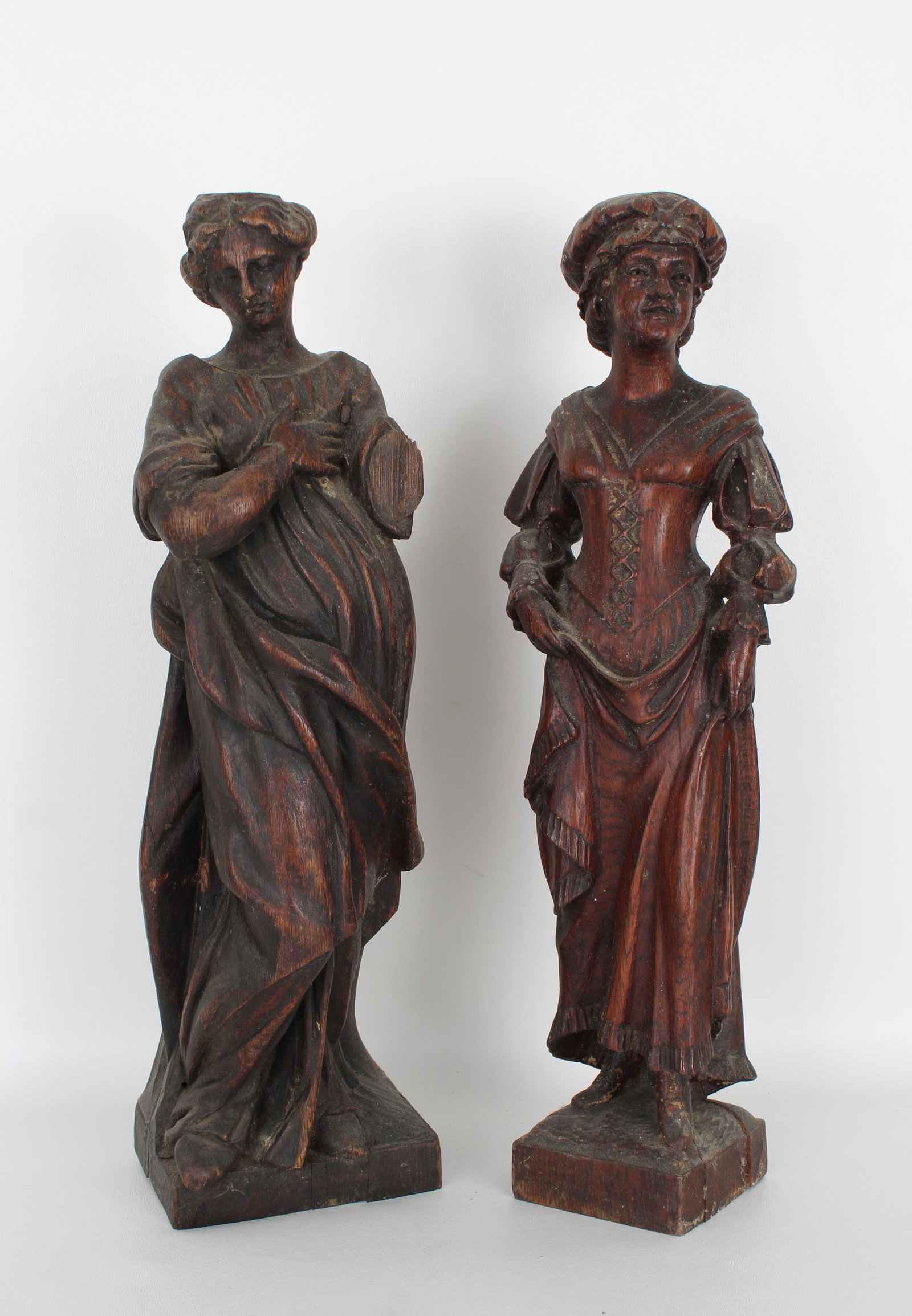 (2) Antique Carved Wood Figures: (2) Antique Carved Wood Figures. Height: 17.5 in.