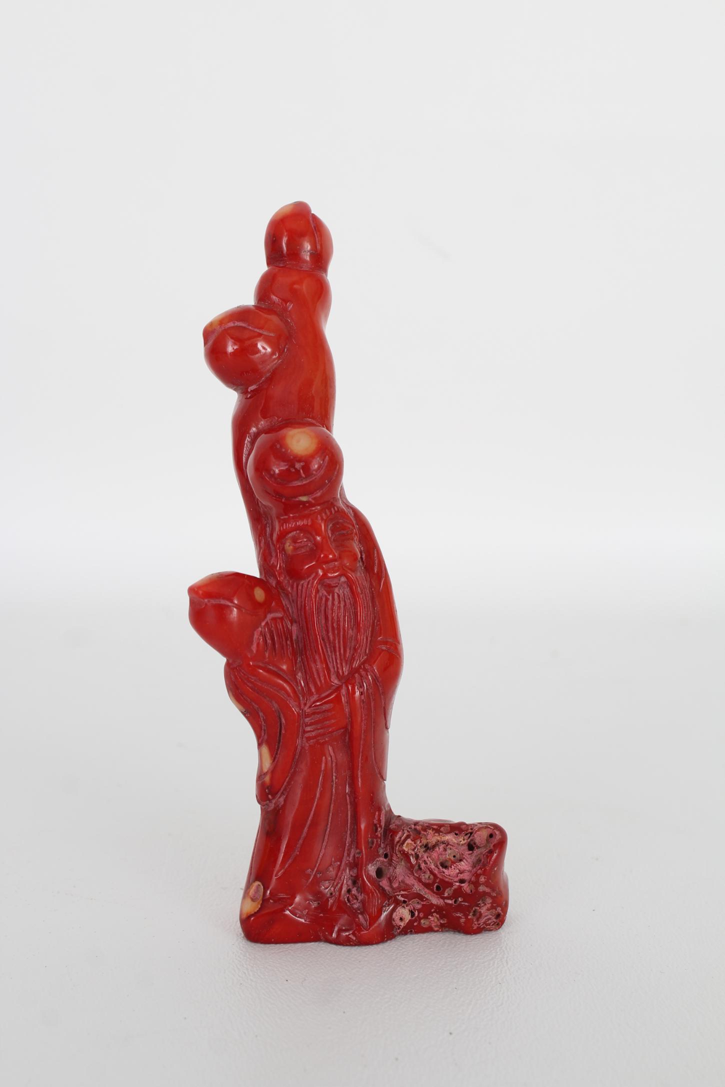 Chinese Carved Coral Lohan Figure: Chinese Carved Coral Lohan Figure. Height: 5.25 inches.