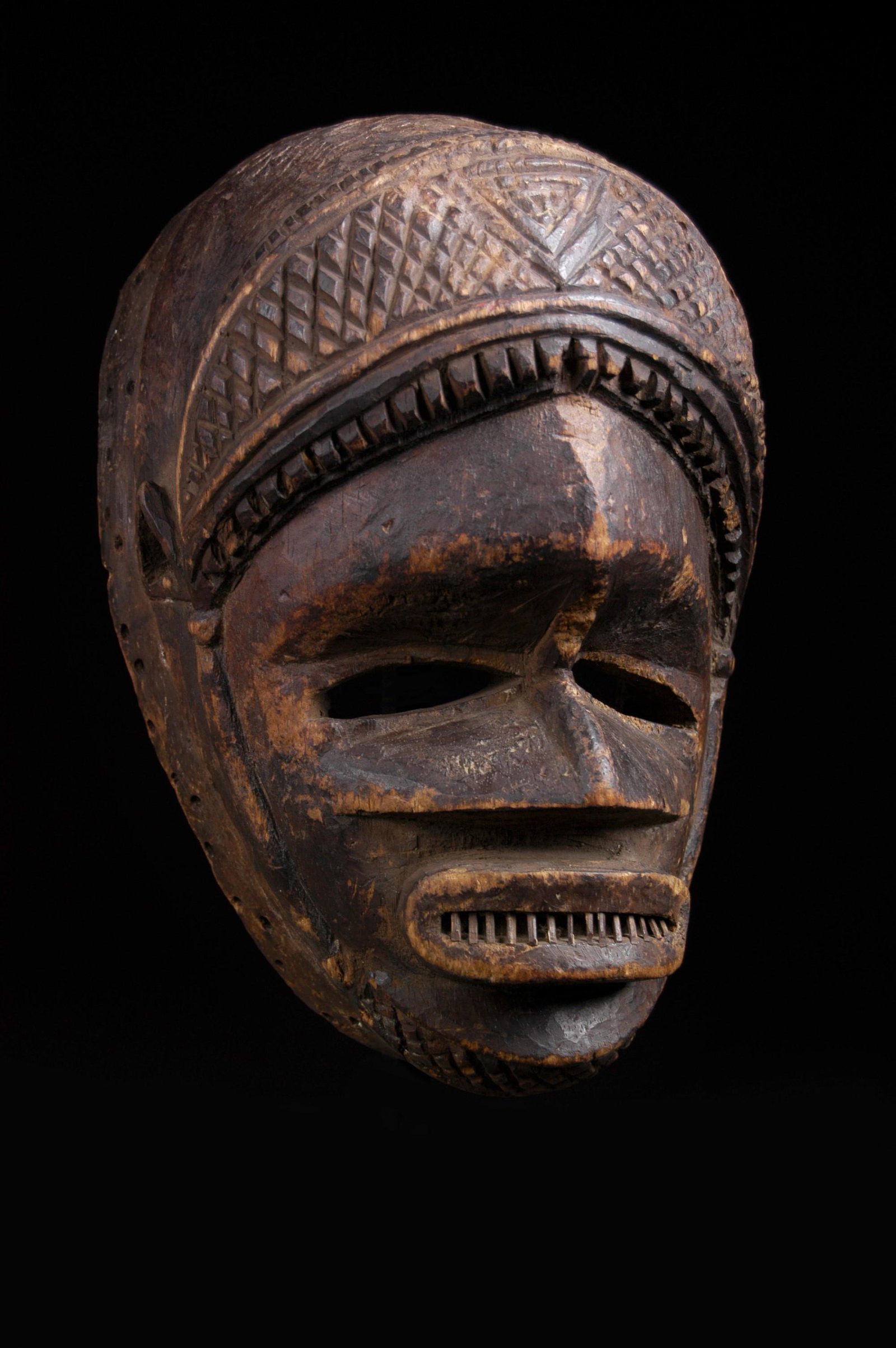 "Agbodogin" Mask (Ishan Ppl) Nigeria: Face mask (Agbodogin) Ishan people. Nigeria, West Africa. Early-mid 20th C. Wood and reed sections. Condition: Very good with some old gnaw marks from a rodent along the edges of features and high poi