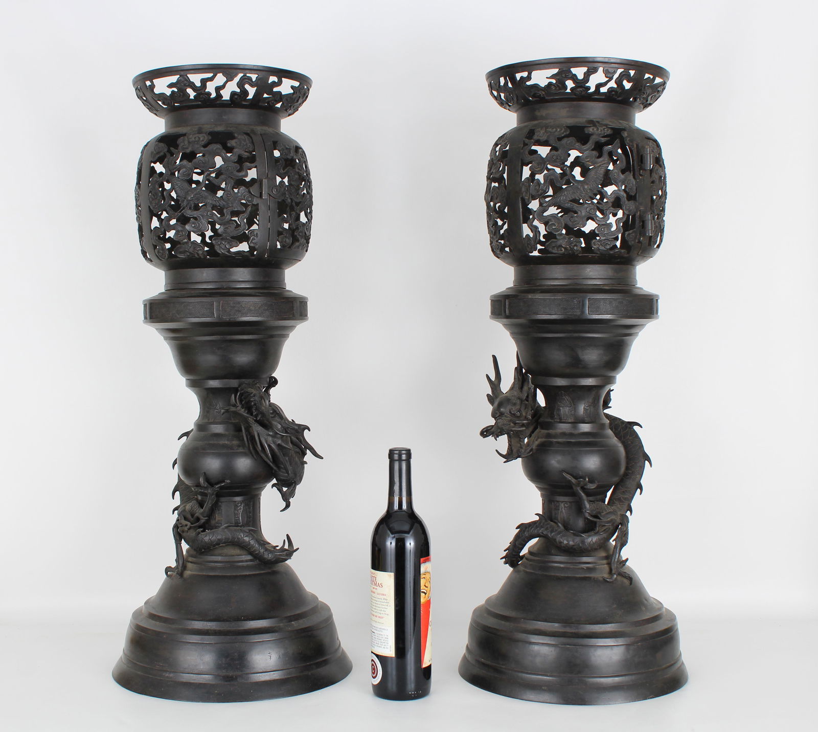 Signed Pair of Bronze Chinese Lanterns: Signed Pair of Bronze Chinese Lanterns. Each with dragons surrounding the lower portion of the Lantern. Reticulated upper portion of lanterns with cranes. Overall Dimensions: 30.25 x 12 in. (each)