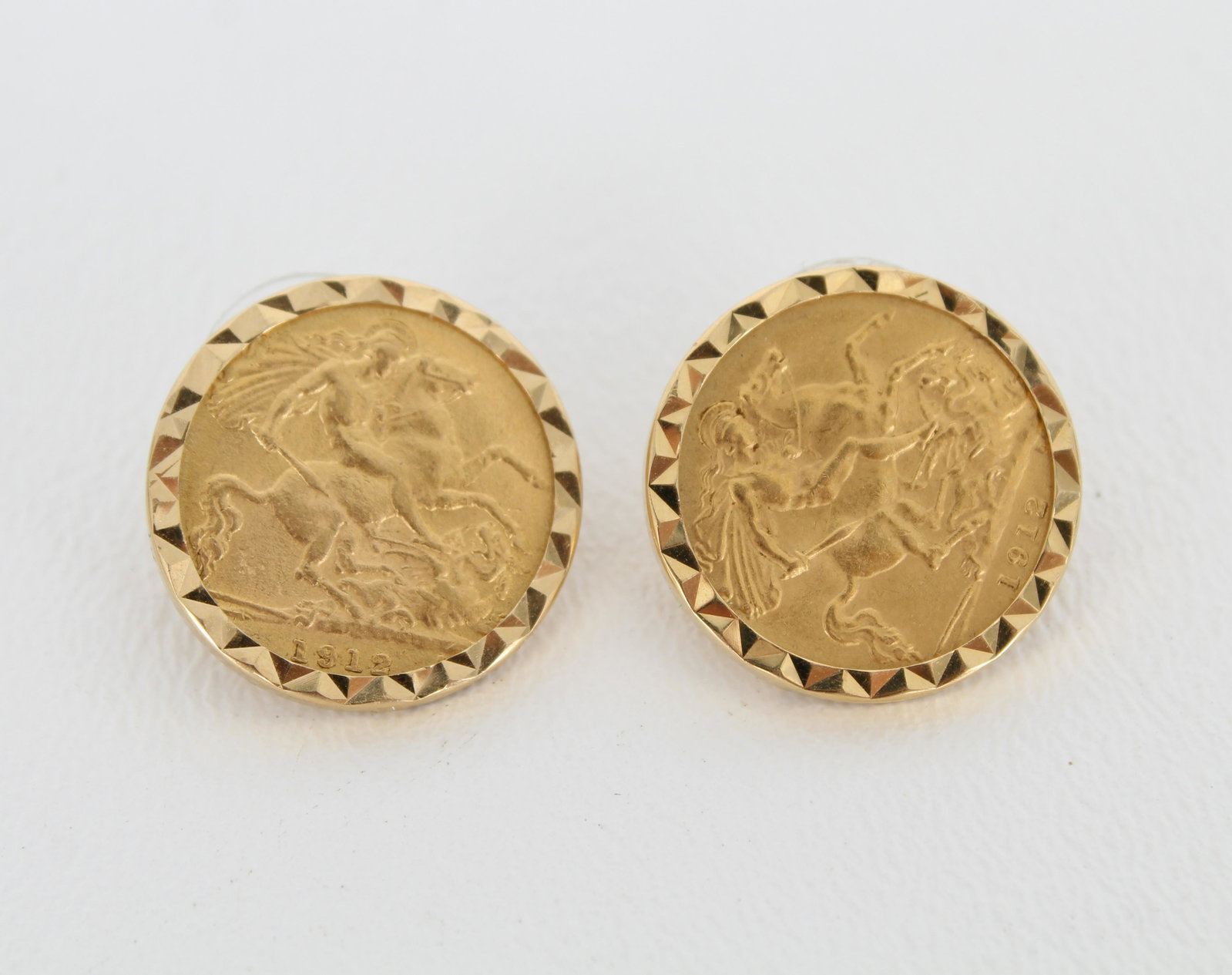 1912 King George V Sovereign 22K Coin Earrings: Pair of 1912 King George V Gold Sovereign 22K Coin Earrings in 18K gold mounts. Approx Total Weight: 8.2 dwt Diameters: 2.2 cm - All silver, gold and/or jewelry lots or invoices containing said lots M