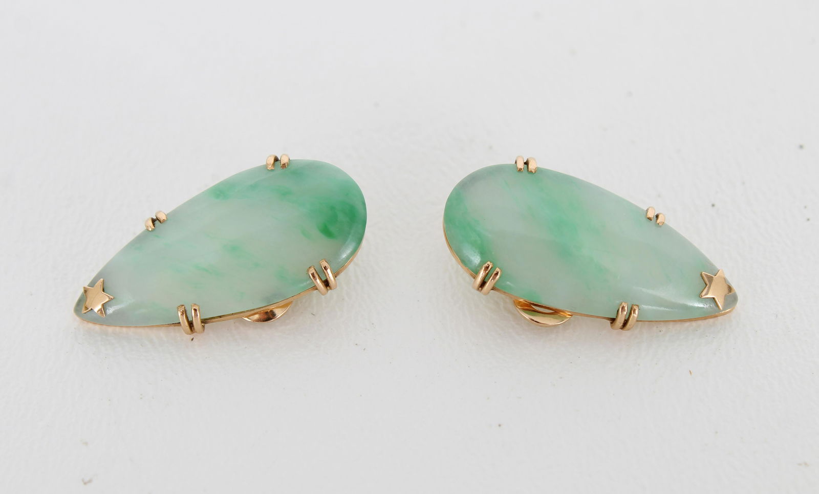 Pair of Tear Drop Style Jade Earrings: Pair of Tear Drop Style Jade Earrings in gold mounts. Having pinch style clasp. Approx Total Weight: 11.8 g Size: 3 x 1.4 cm.
