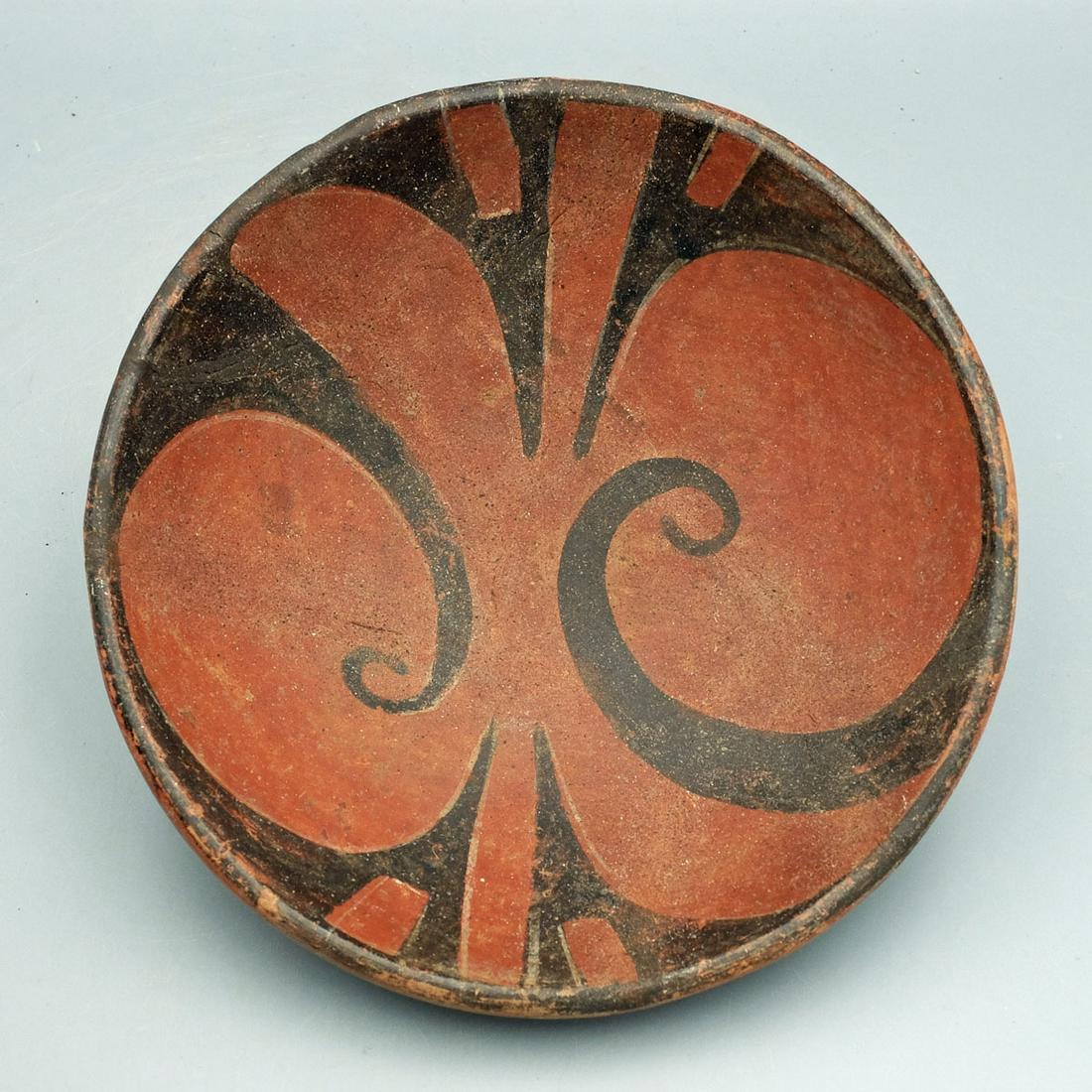 Ciruelo Black-on-Red Tri-Chrome Bowl: A choice Ciruelo black-on-red tri-chrome bowl from the Tonosi area of Panama, ca. 900 - 500 BC. This superb Zahina Polychrome vessel is 7-3/8 in. in diameter and is decorated with Binary Geometric des