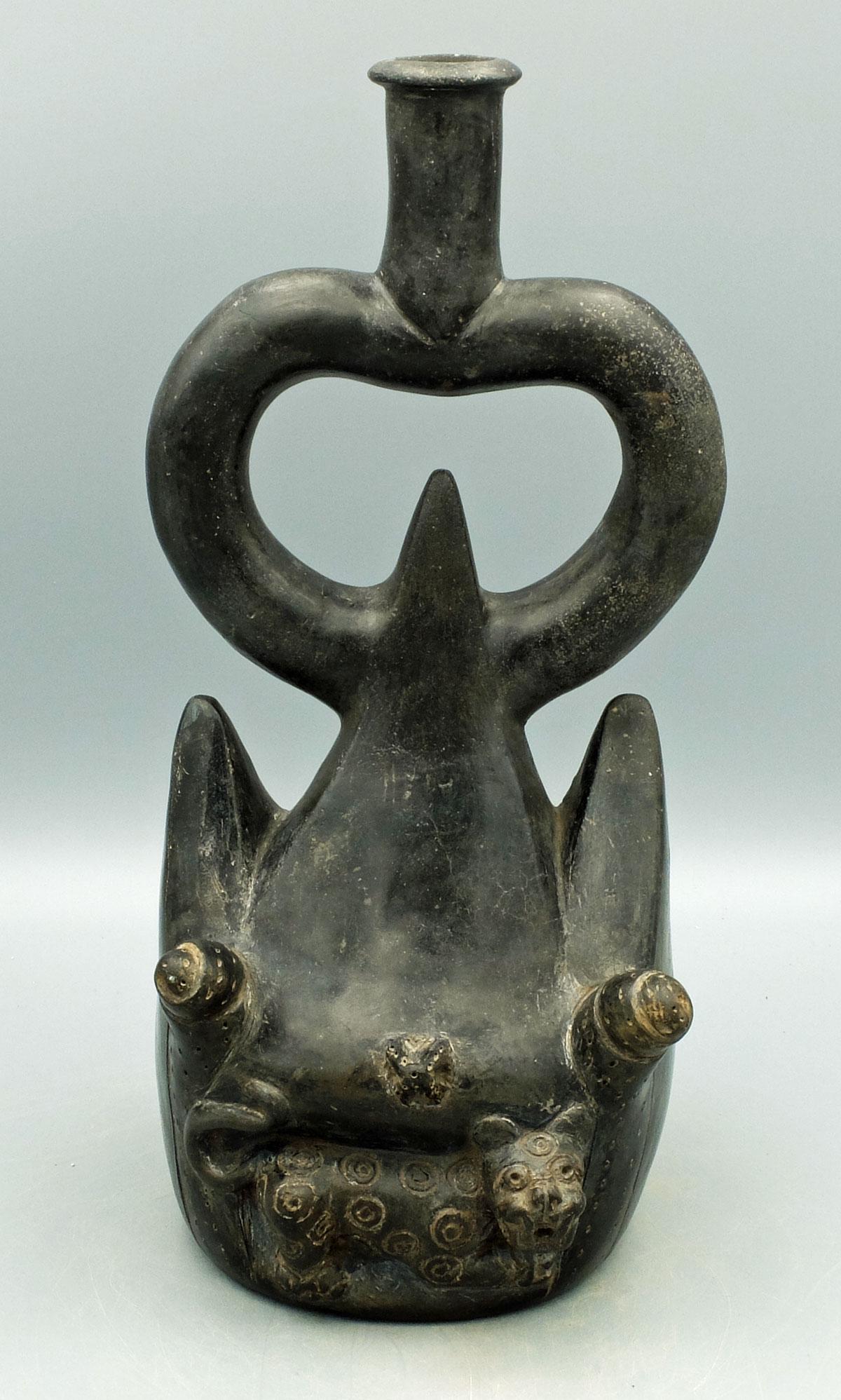 Moche I Bottle - Peru, ca. 50 BC - 100 AD: A lovely Moche I bottle from the Loma Negra area of Peru, ca. 50 BC - 100 AD. It is 11 in. high and features a jaguar emerging from a cave at the base of the Sacred Mountains. A pair of large snails d