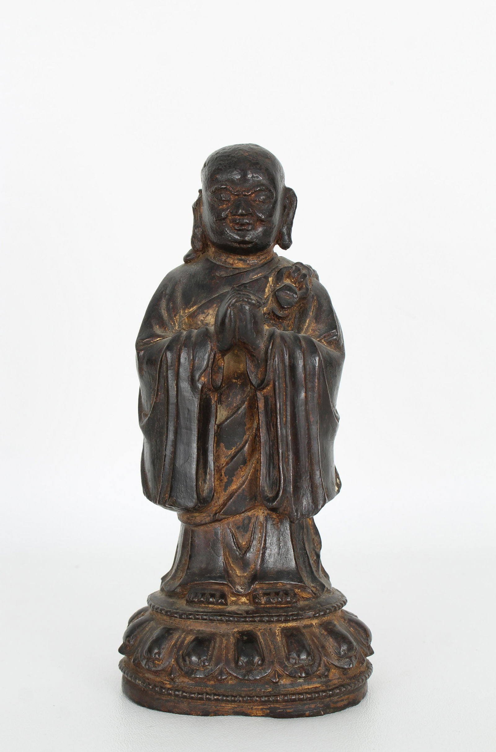 Antique Chinese Bronze Louhan Figure: Antique Chinese Bronze Louhan Figure. With remnants of gilding throughout. Height: 7.5 in.